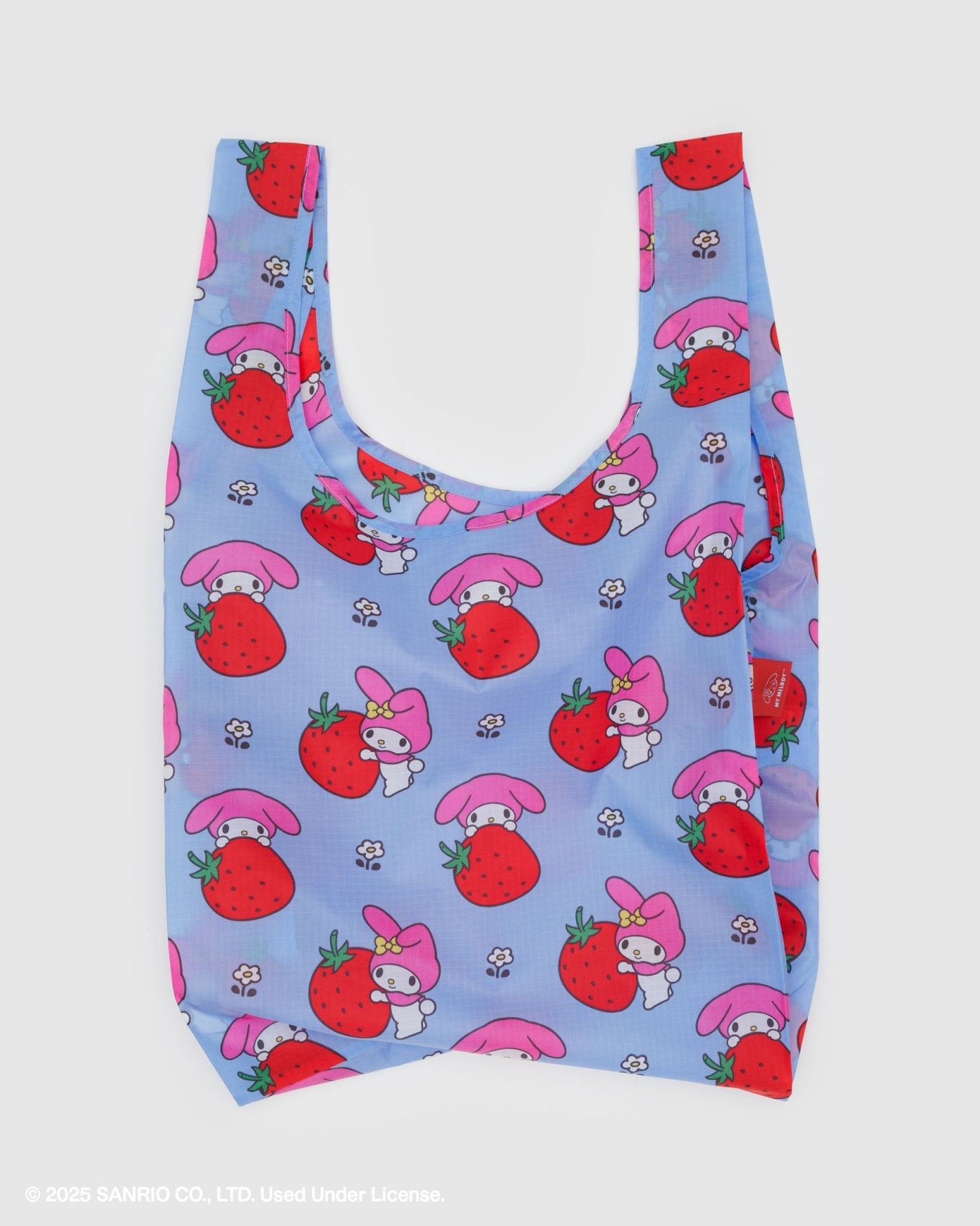 Reusable bag with white rabbit cartoon character and strawberry pattern on a light blue background