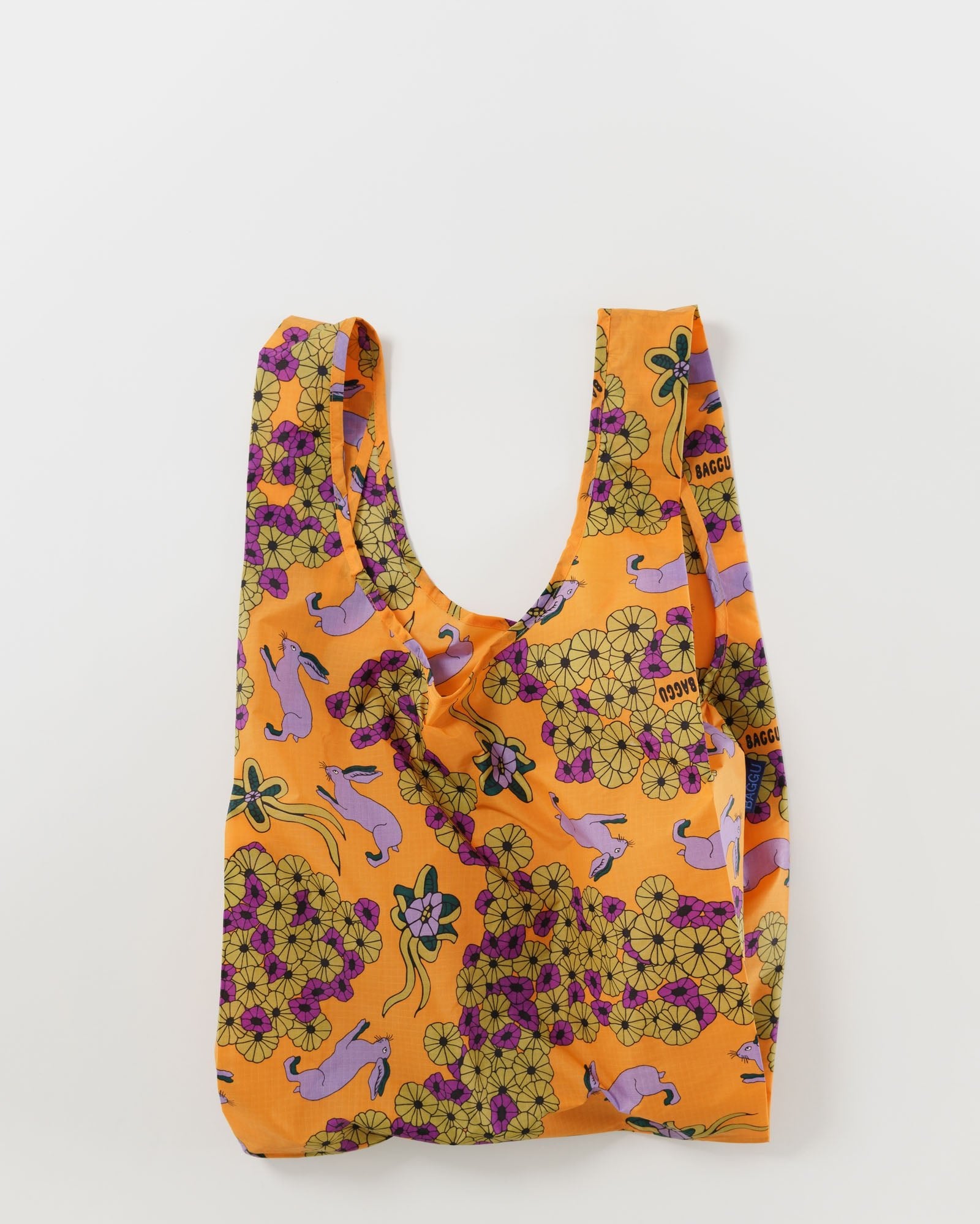 Standard size reusable orange bag with floral and purple rabbit pattern
