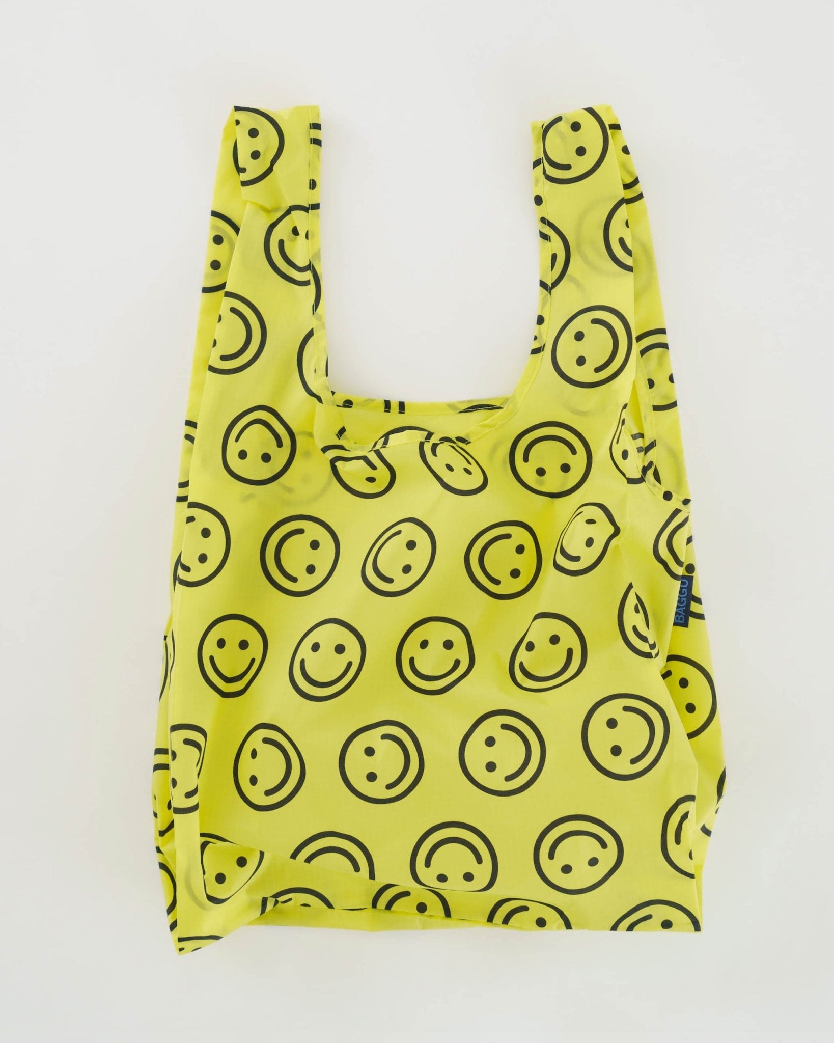 Baggu Standard Baggu Reusable Bag in yellow with smiley faces in black outline - ANNIE.G