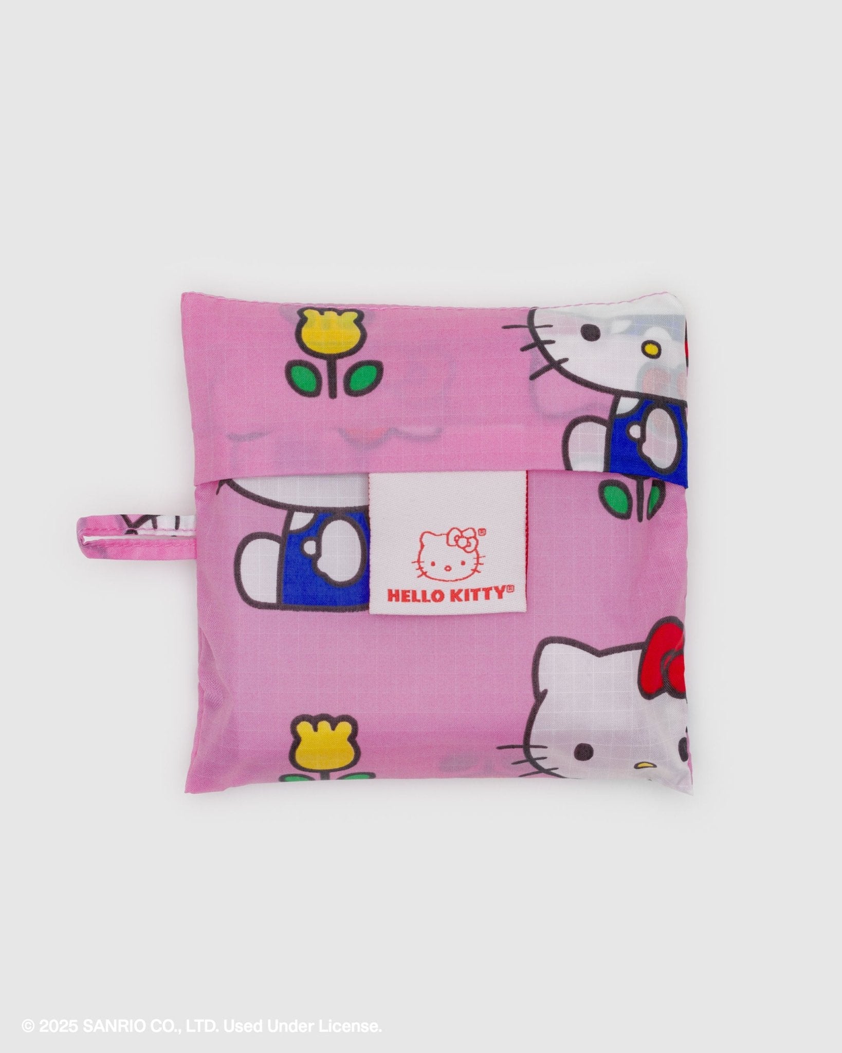 Pink Hello Kitty storage pouch with a white tag and loop at side