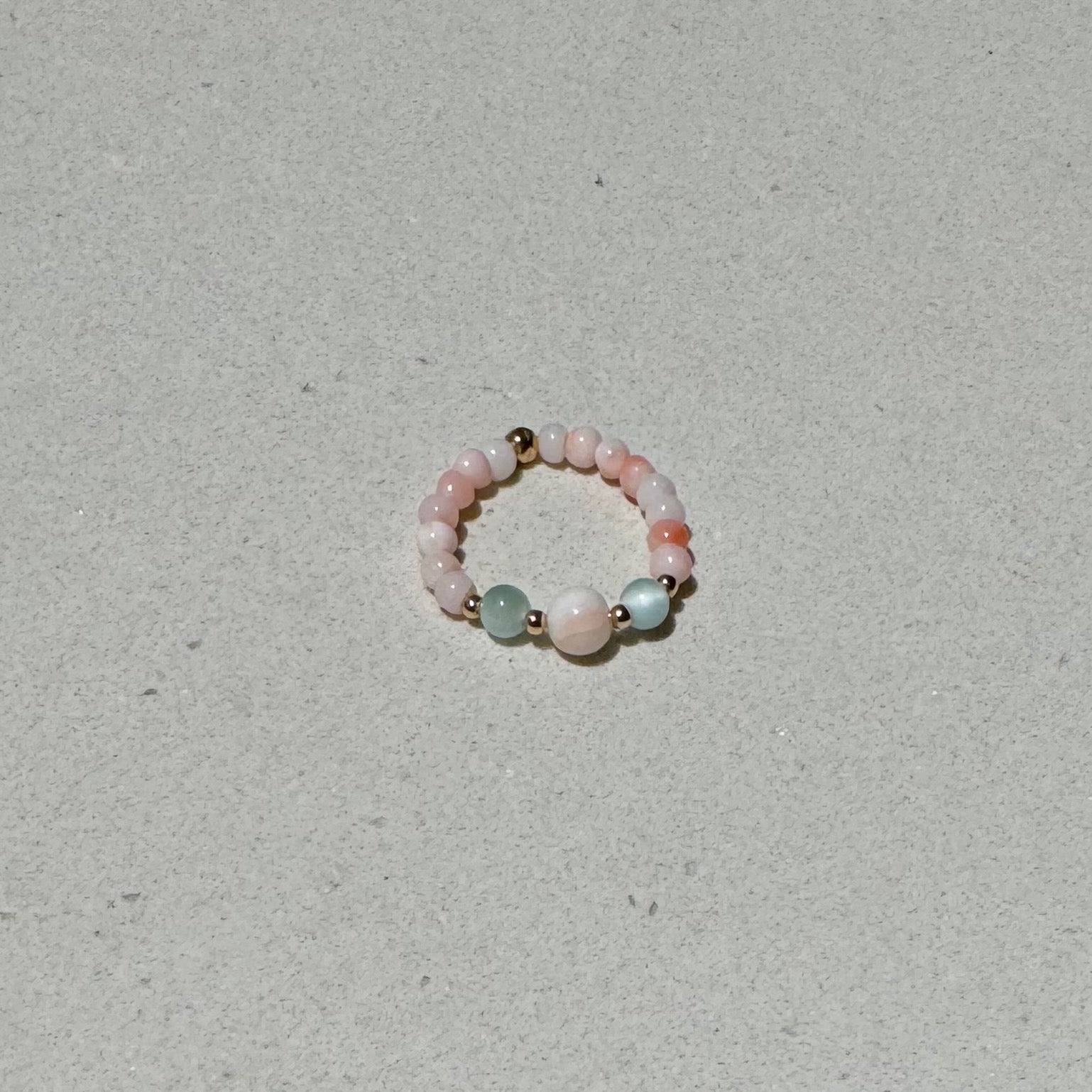 Bead Stretch Ring in natural stones on a bench