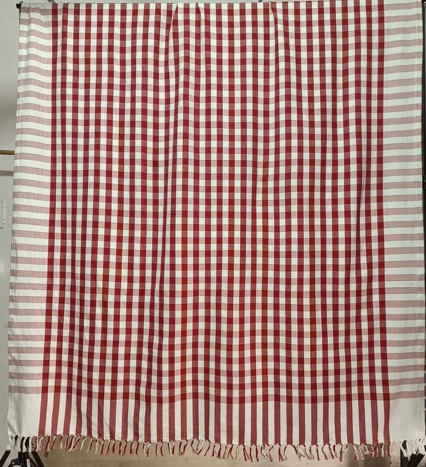 handknotted-edge-of-red-gingham-pattern-coastline-check-tablecloth-hanging