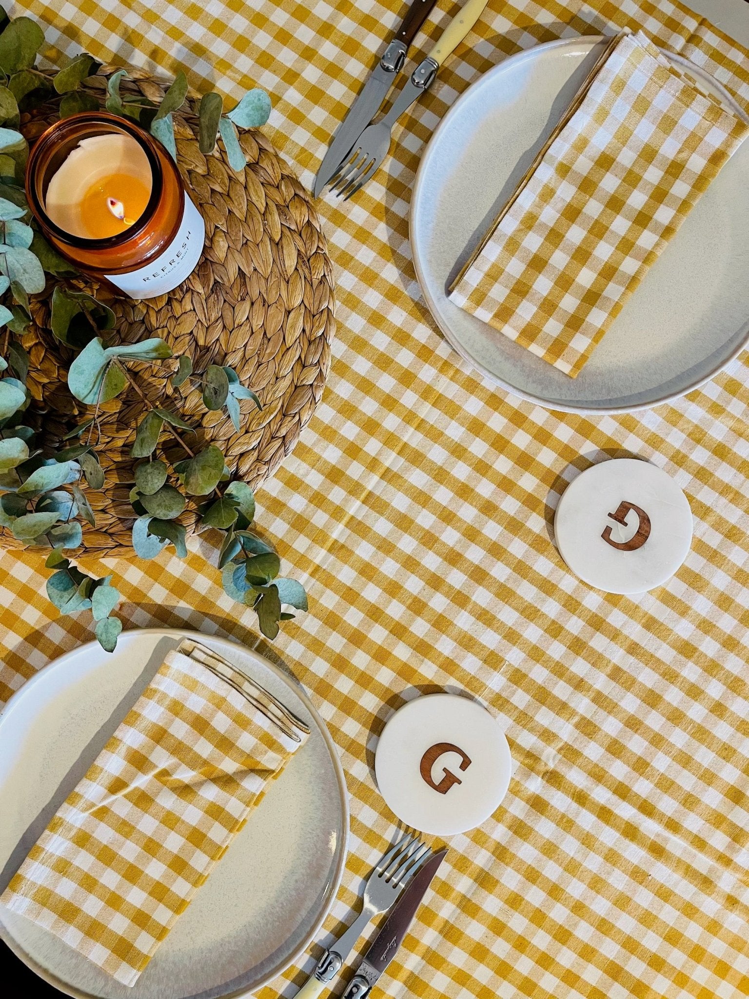 Gold and white checked Gingham Cotton Tablecloth and napkins on a set table with candle and coasters - ANNIE.G