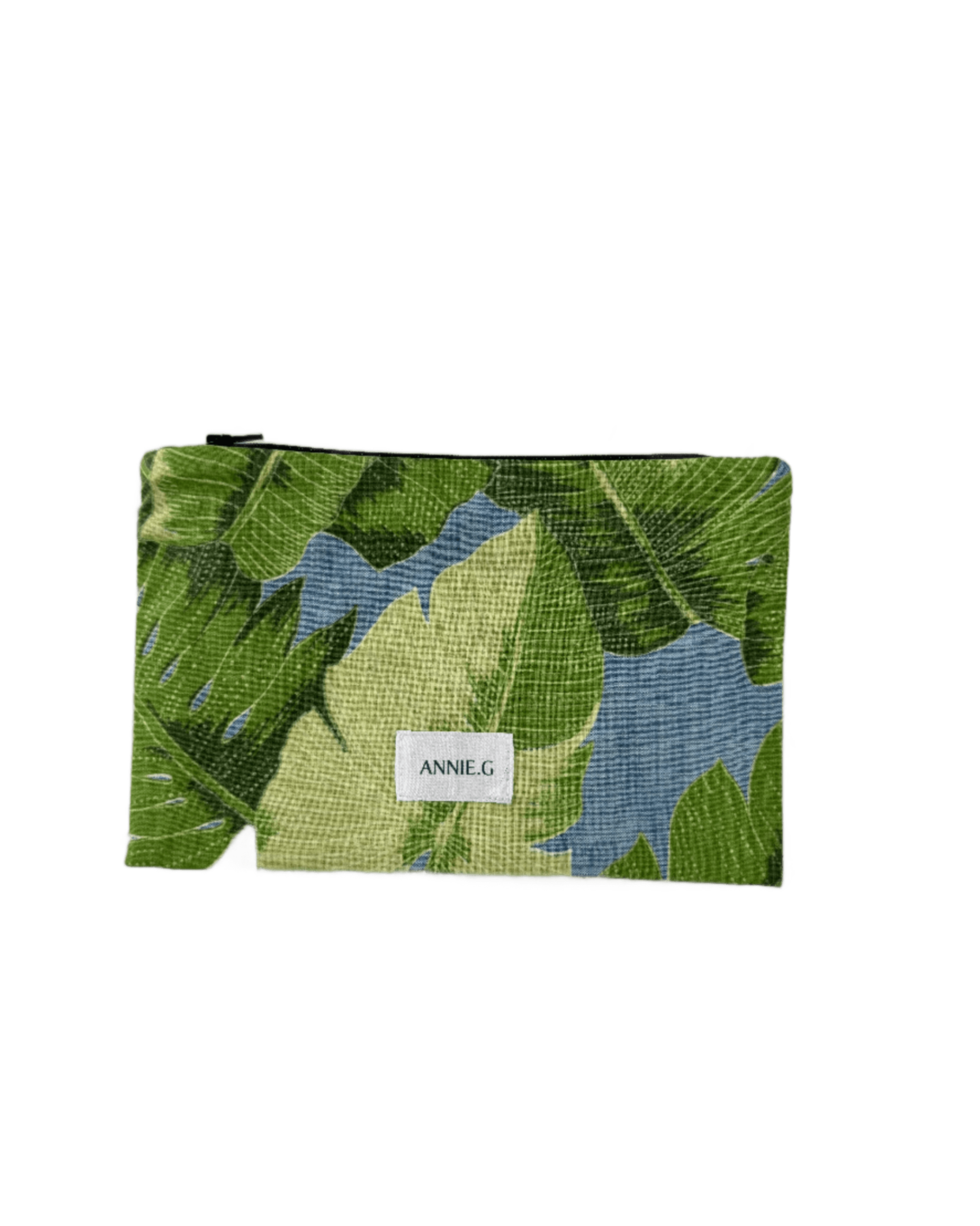 Large green leaves on blue background with zipper top and brand logo ANNIE.G sewn on the front.