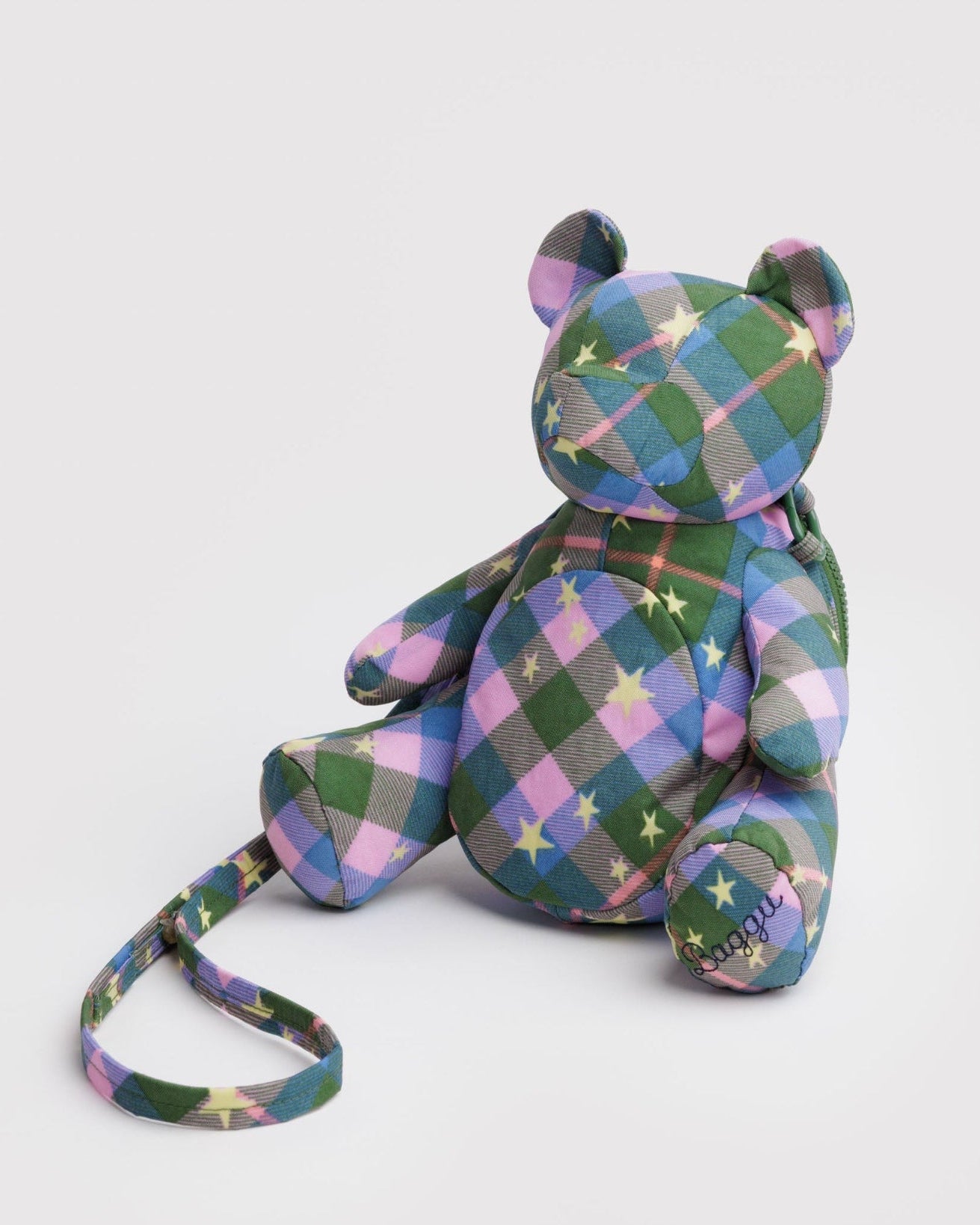 Green, blue and pink plaid patterned teddy bear bag with an adjustable crossbody strap.