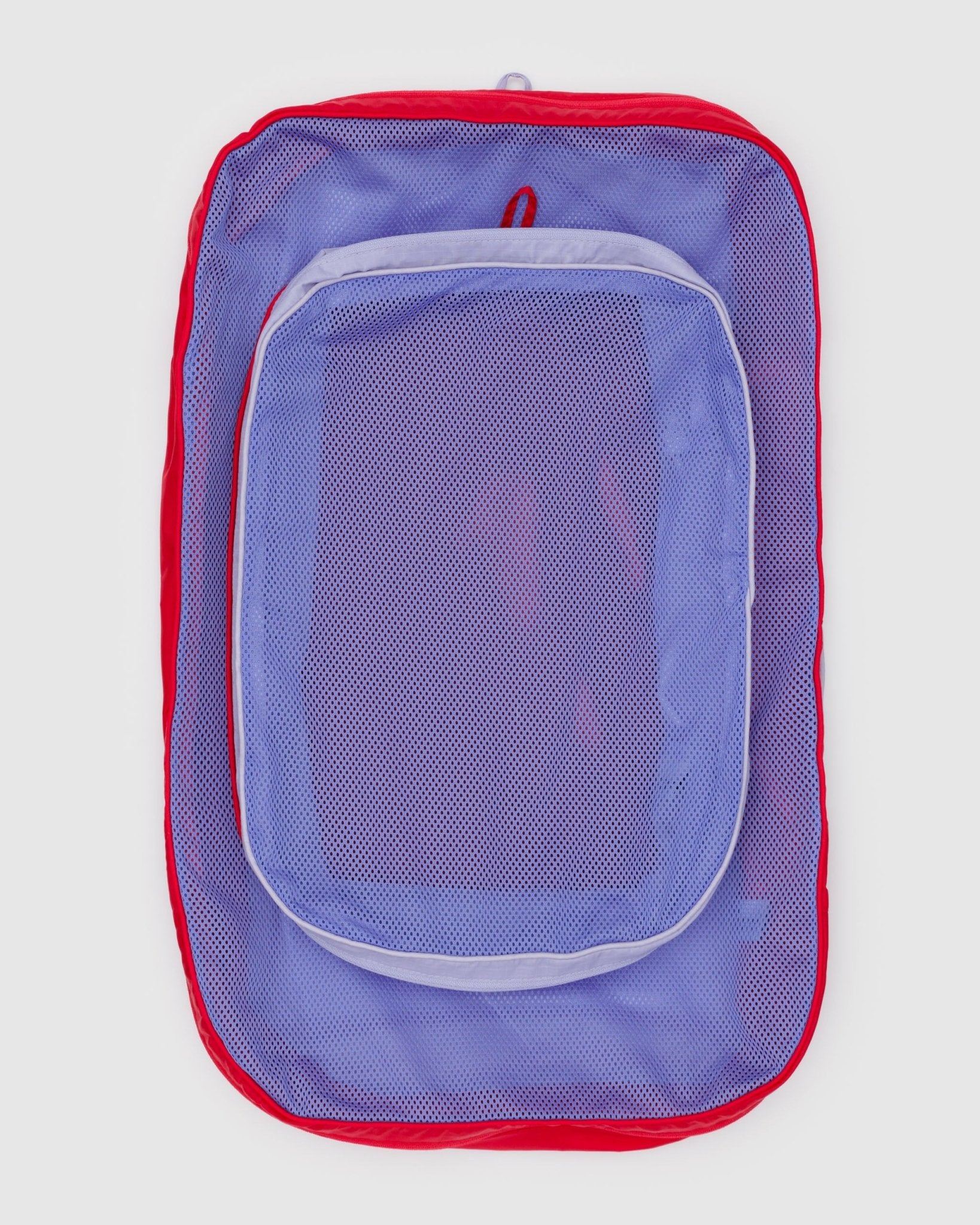 Set of 2 large empty packing cubes with mesh top and hanging loops in red and purple.