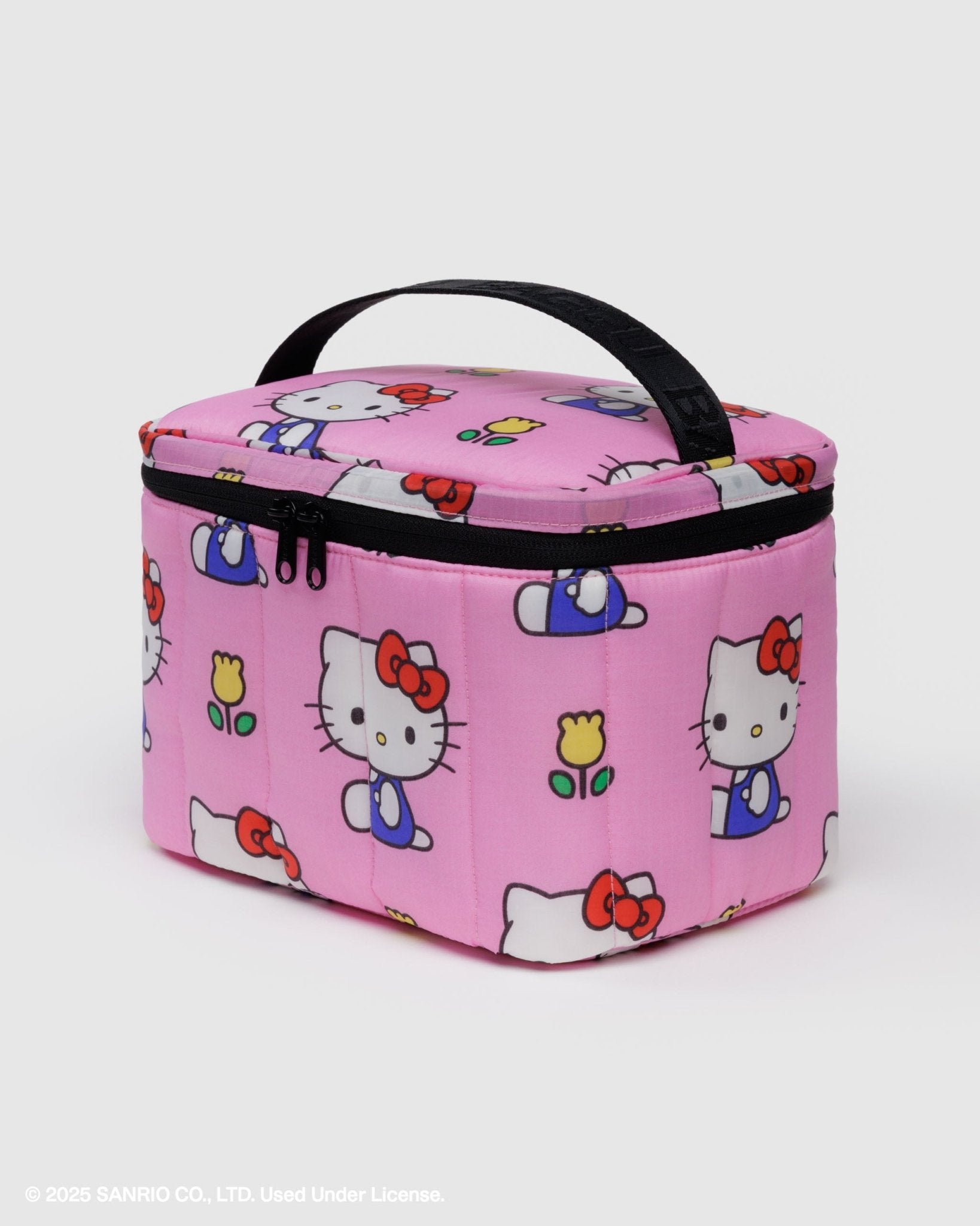 Pink quilted luch bag with Hello Kitty design and black top handle and zip top