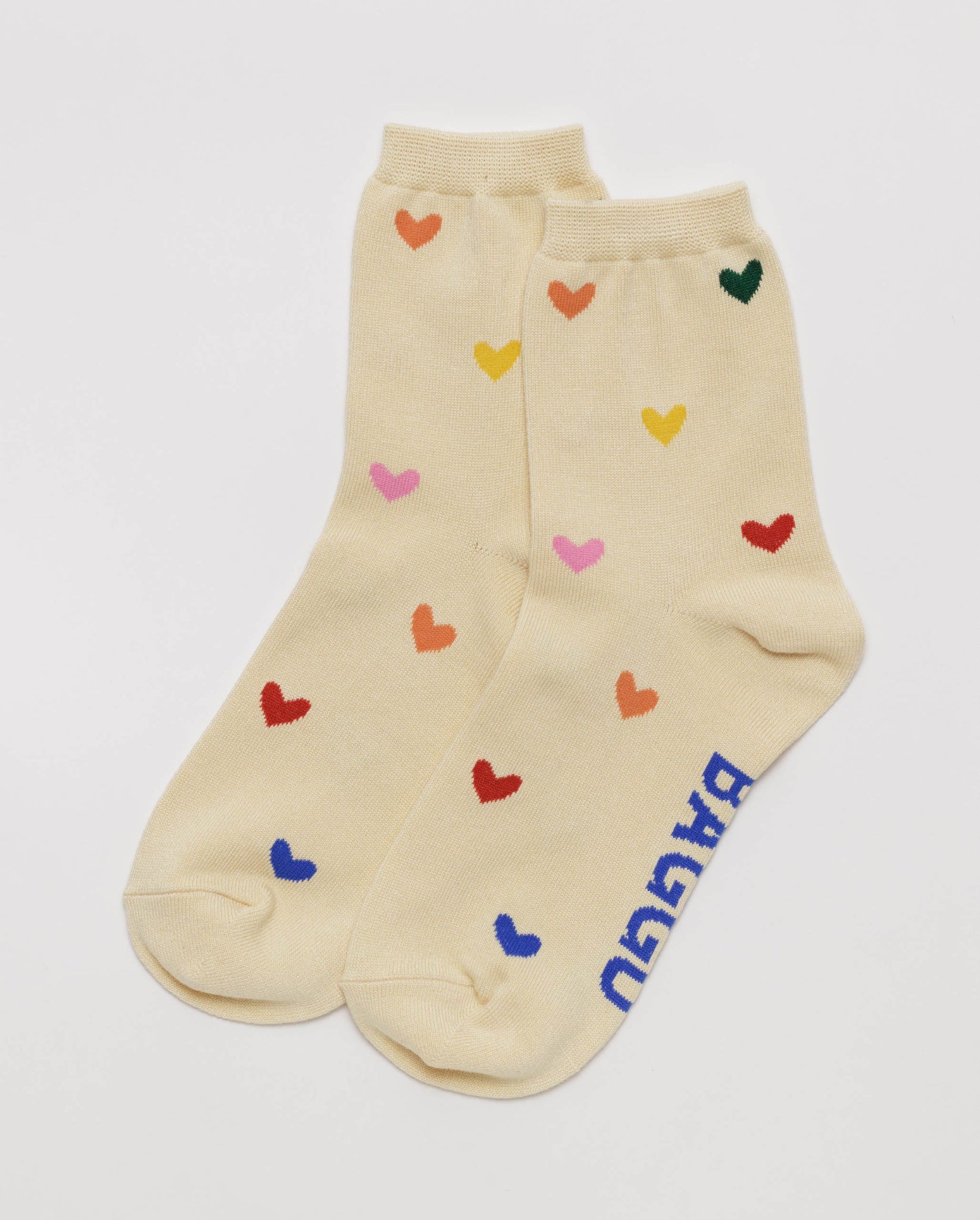Pair of cream socks with colourful heart patterns.