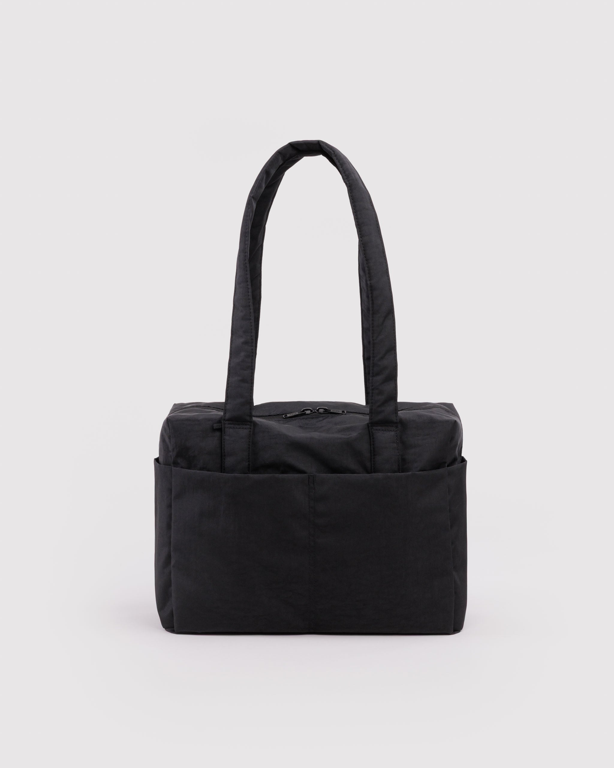Black tote bag with outside pockets, double top zippers and carry handles.