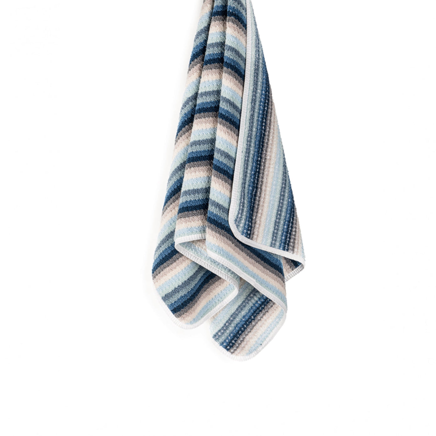 Striped cotton towel with blue, beige, and white pattern hanging