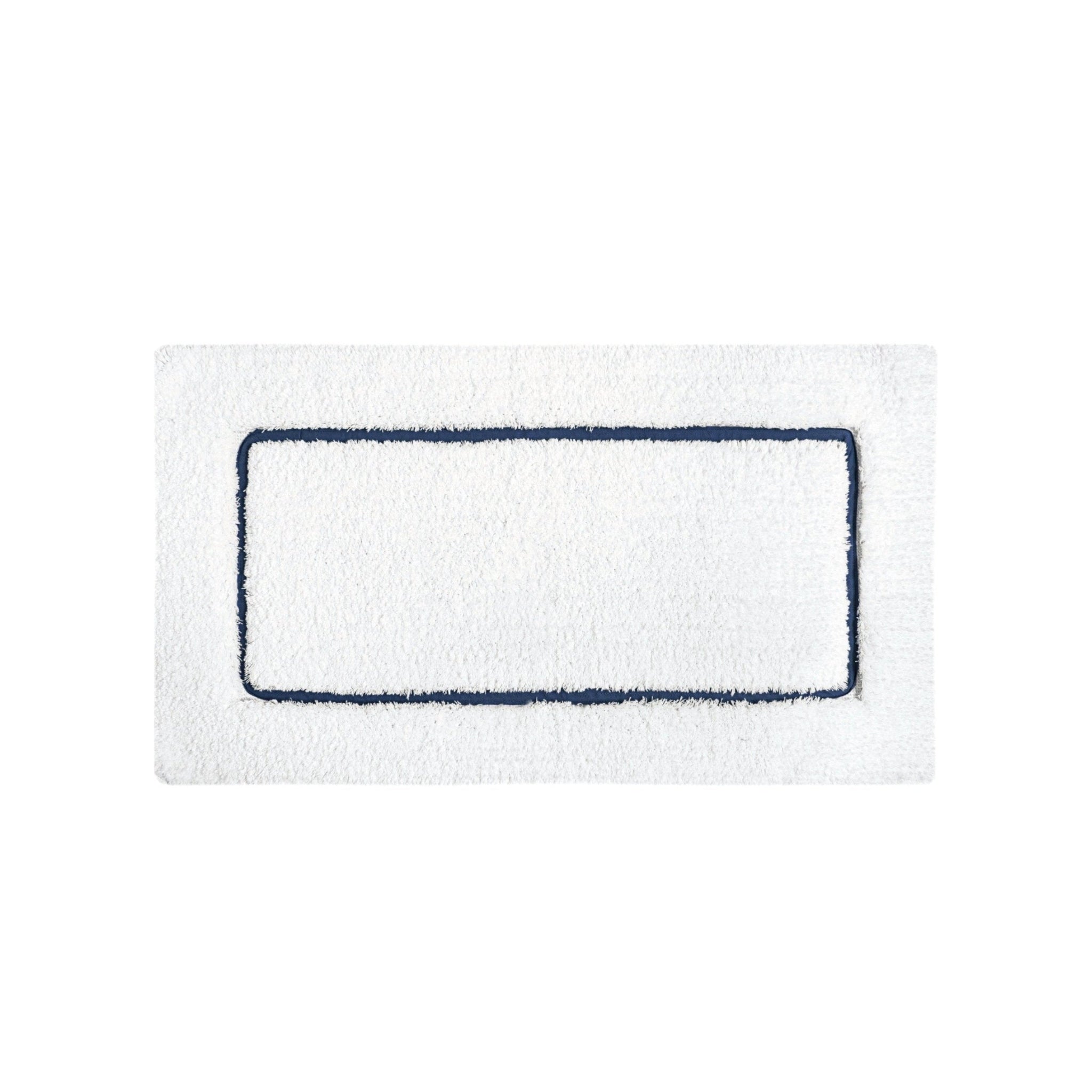 White bath mat with a navy border.