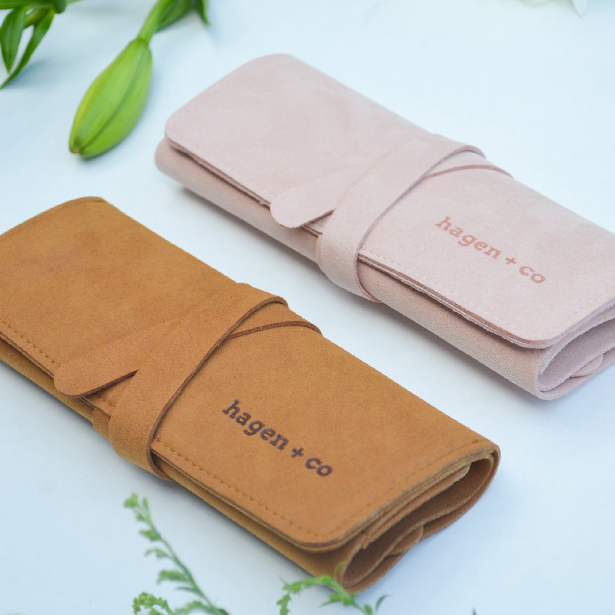 Pink and tan Jewellery Travel Wraps with hagen.+ co branding on front.