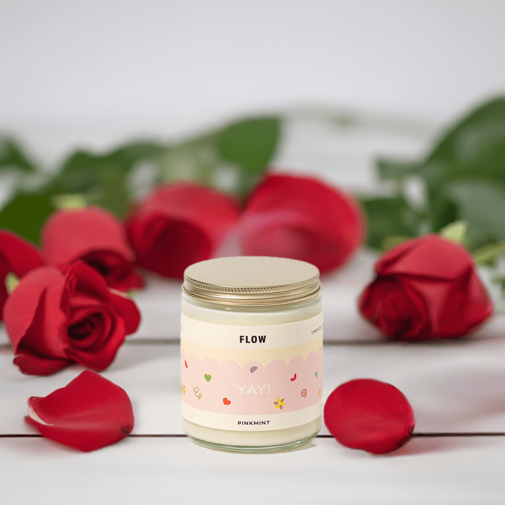 Flow Soy Candle in a jar, 250ml surrounded by red rose petals - ANNIE.G