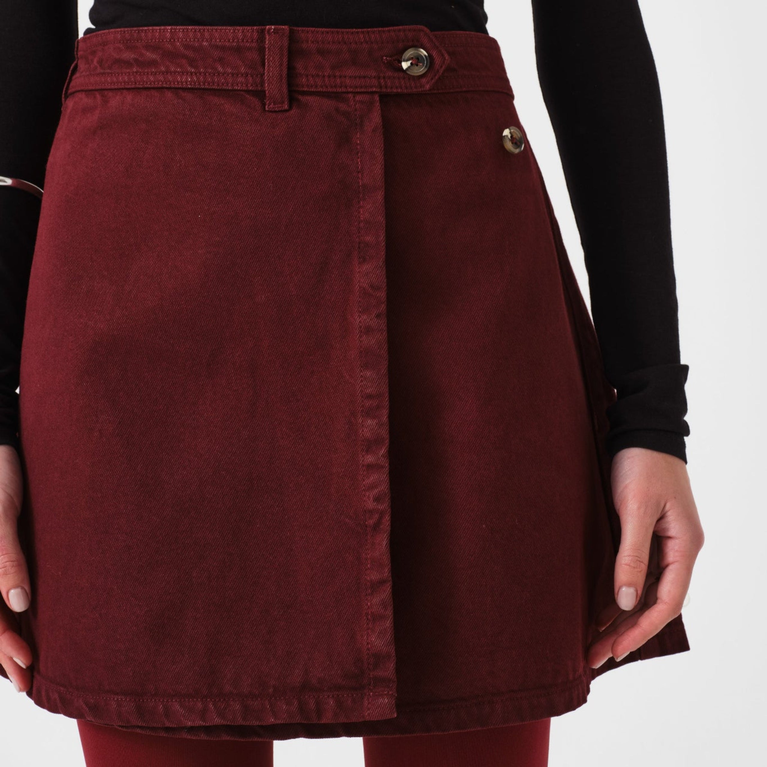 Mulberry mini wrap skirt worn by a person with black top.