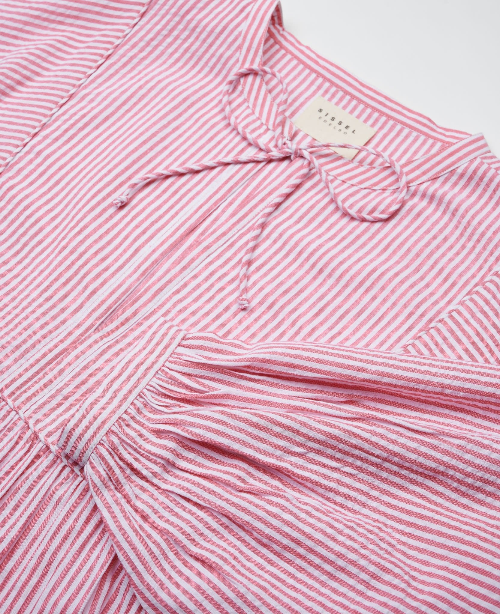 Close up of neckline and ties and long sleeve of red and white stripe dress - ANNIE.G