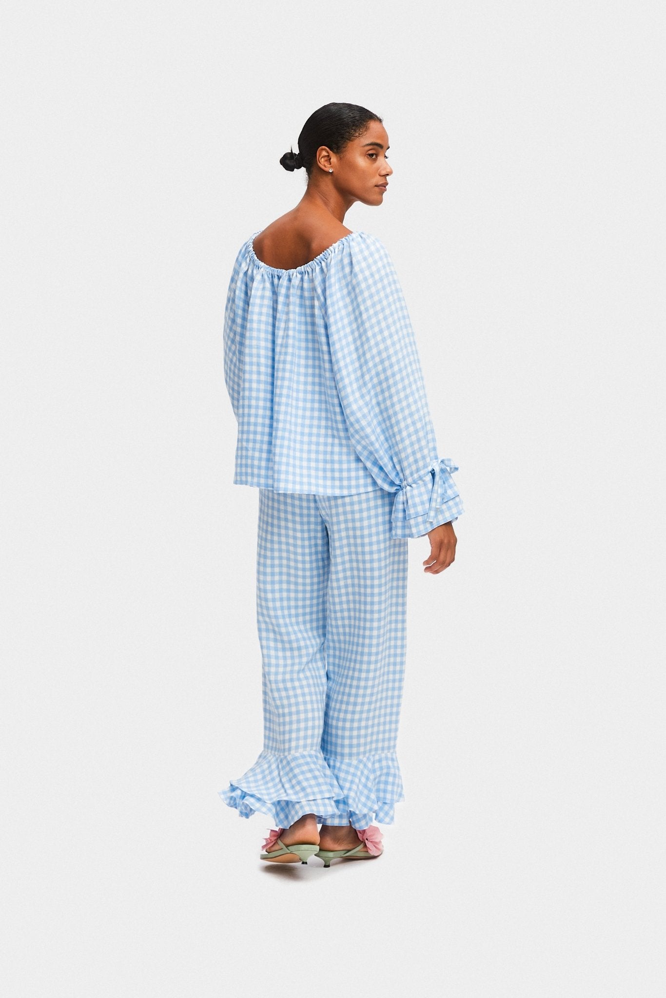 Back of a woman wearing blue gingham linen lounge shirt and pants with ruffles - ANNIE.G