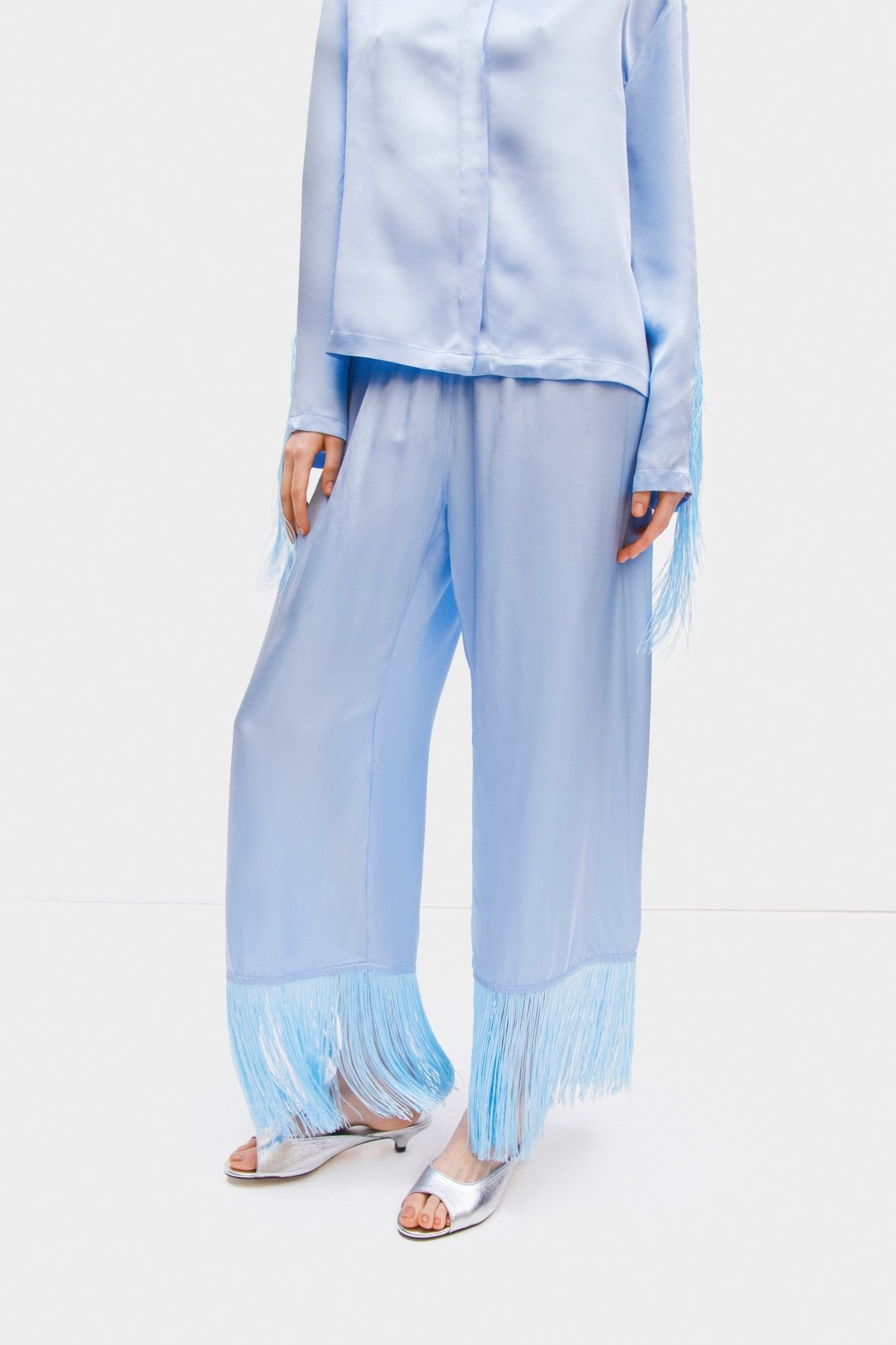 Close up of a person wearing shirt and pants of blue Cosmic Cowboy Fringed Pyjama Set - ANNIE.G