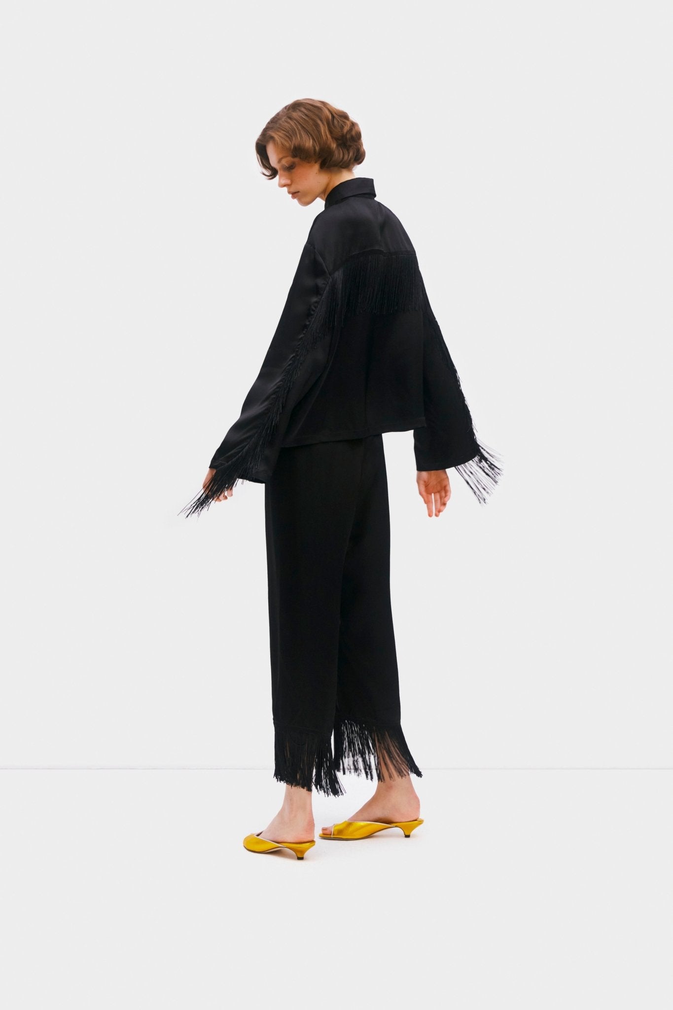 Person moving fringe on shirt and pants cuff of black fringed shirt and pants Pyjama Set - ANNIE.G