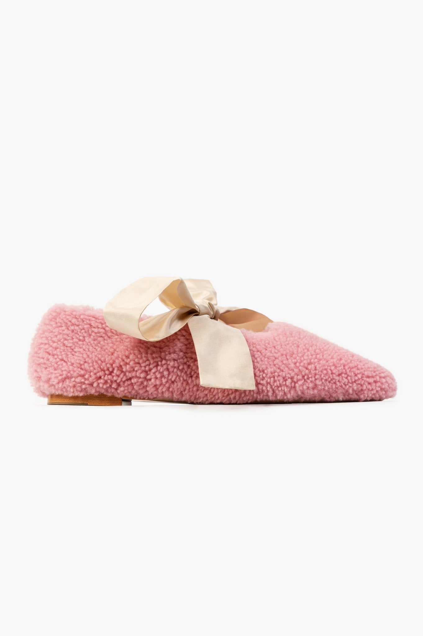 Side of pink shearling slippers with light pink bows and low heel - ANNIE.G