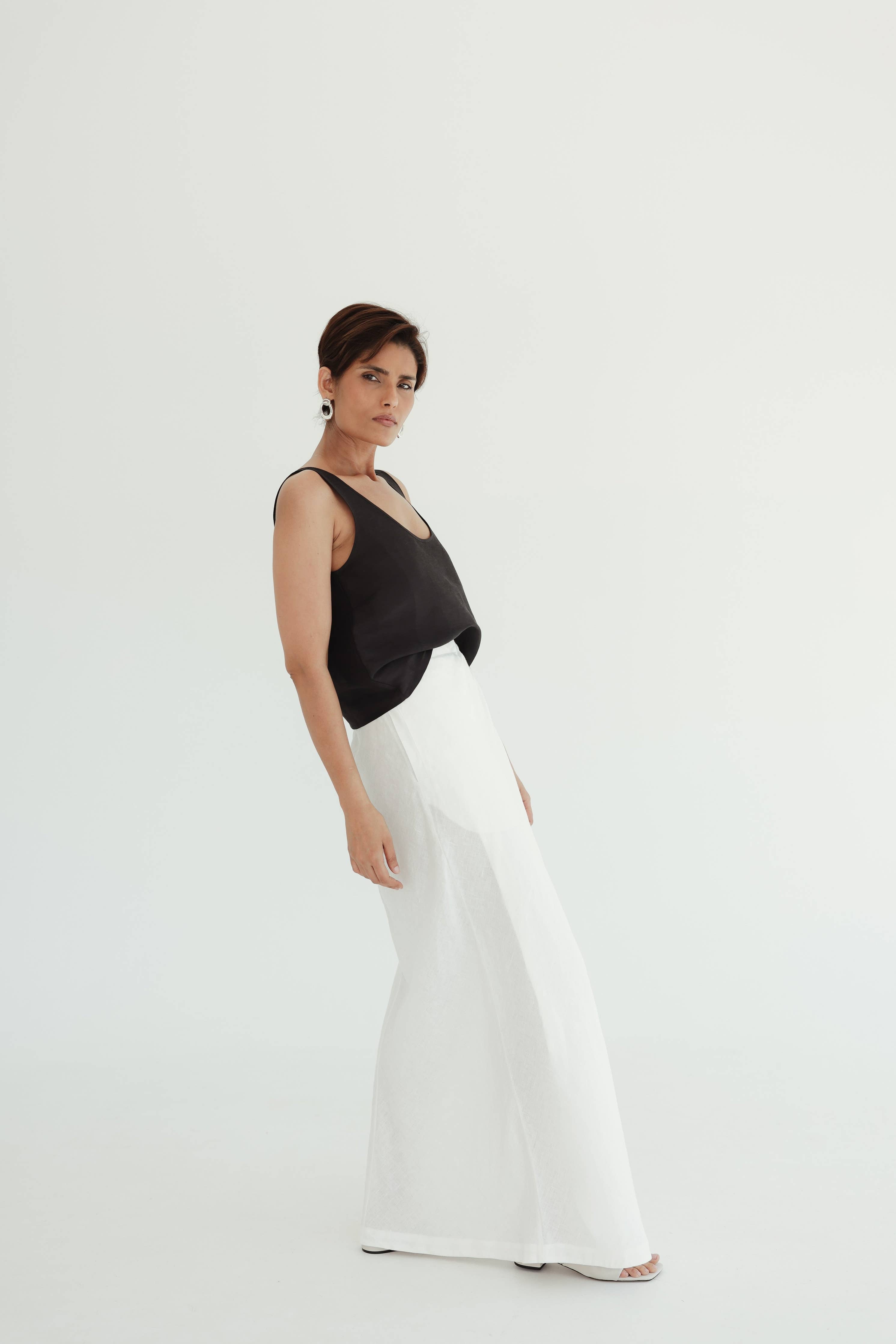 woman-wearing-sofia-cami-top-noir-scoop_neck-and-skirt-standing-showing-side-view