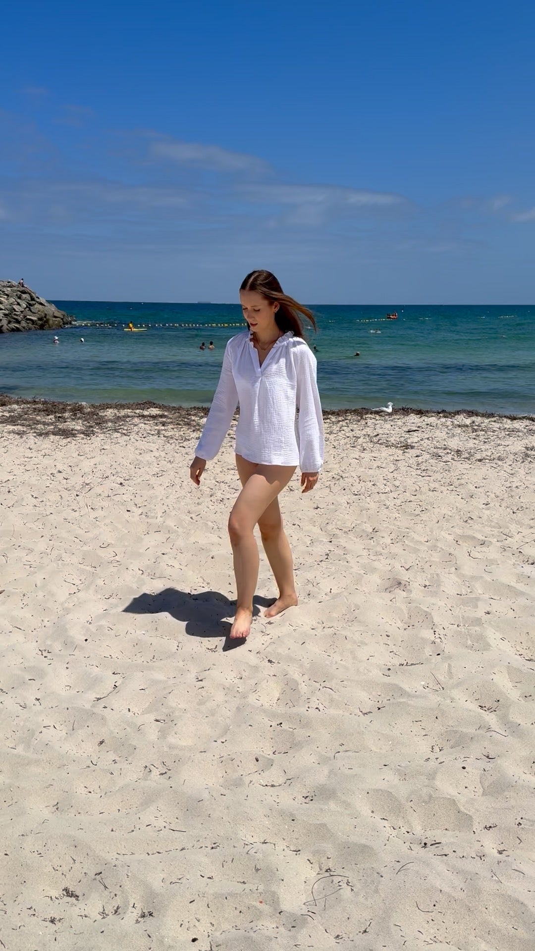 woman-walking-on-beach-in-annie-shirt-cloud_white