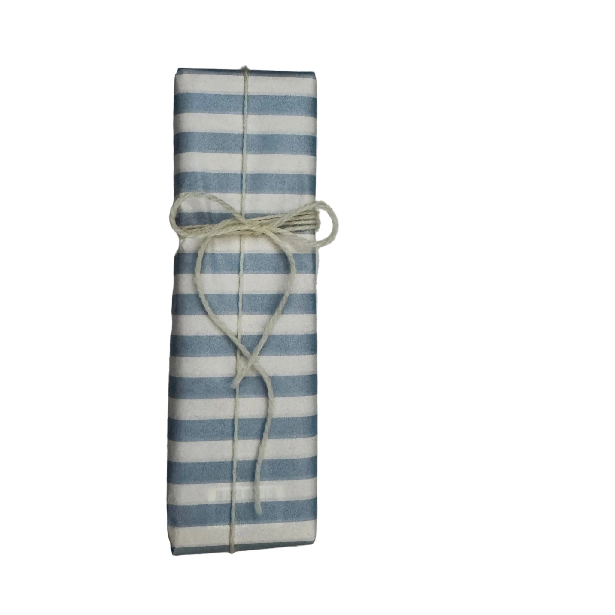 Rectangular box wrapped in blue and white striped paper and tied with cream wool.