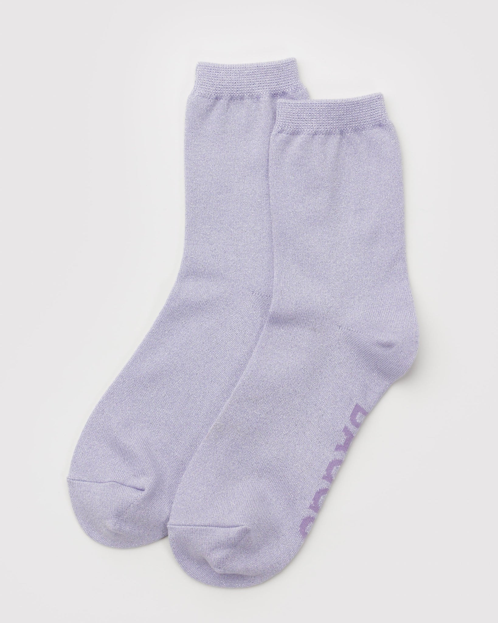 Pair of light purple metallic sockswith BAGGU woven into sole.