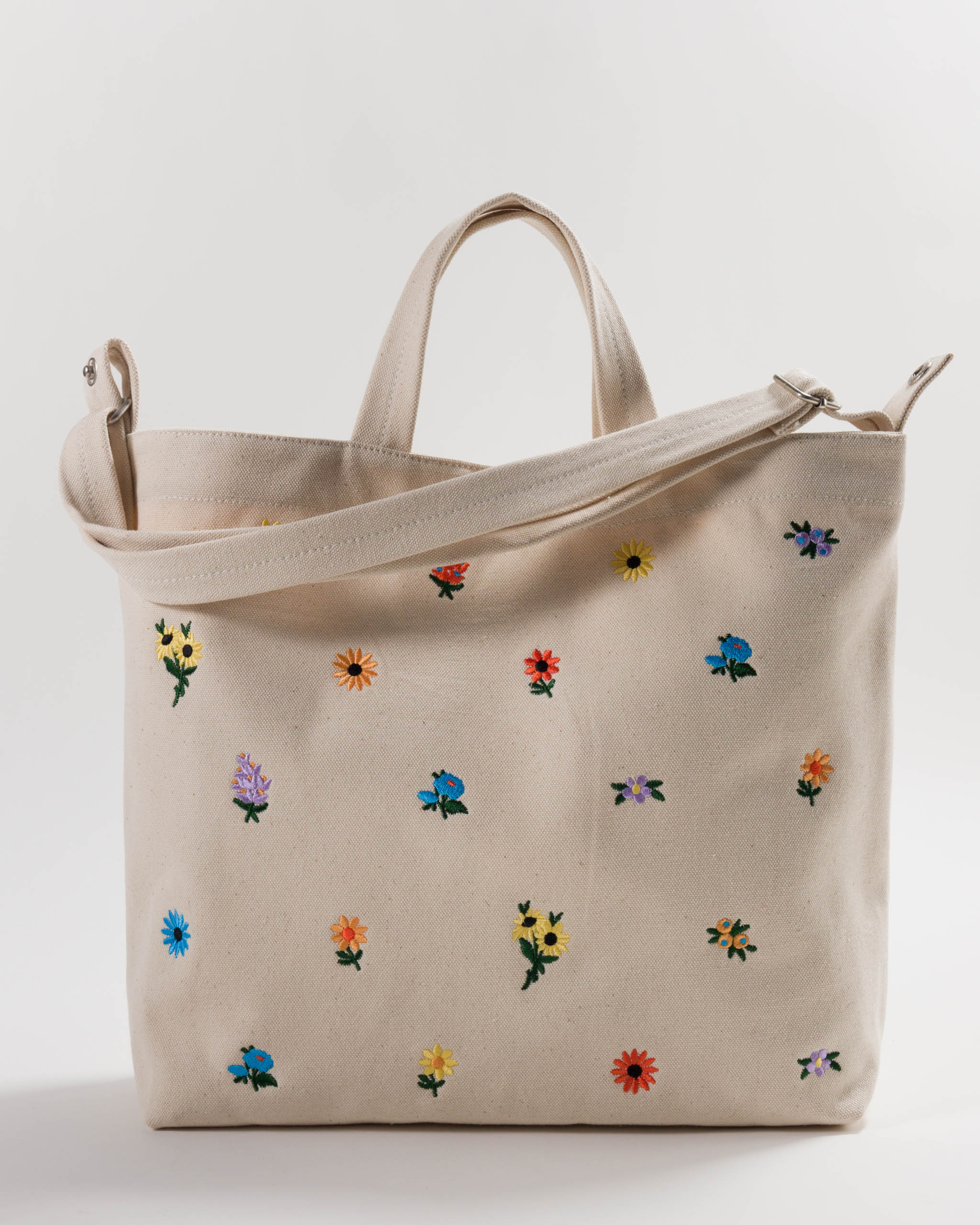 embroidered-floral-designs-on-cotton-canvas-of-wide-tote-bag-with-short-handles-and-long-adjustable-strap