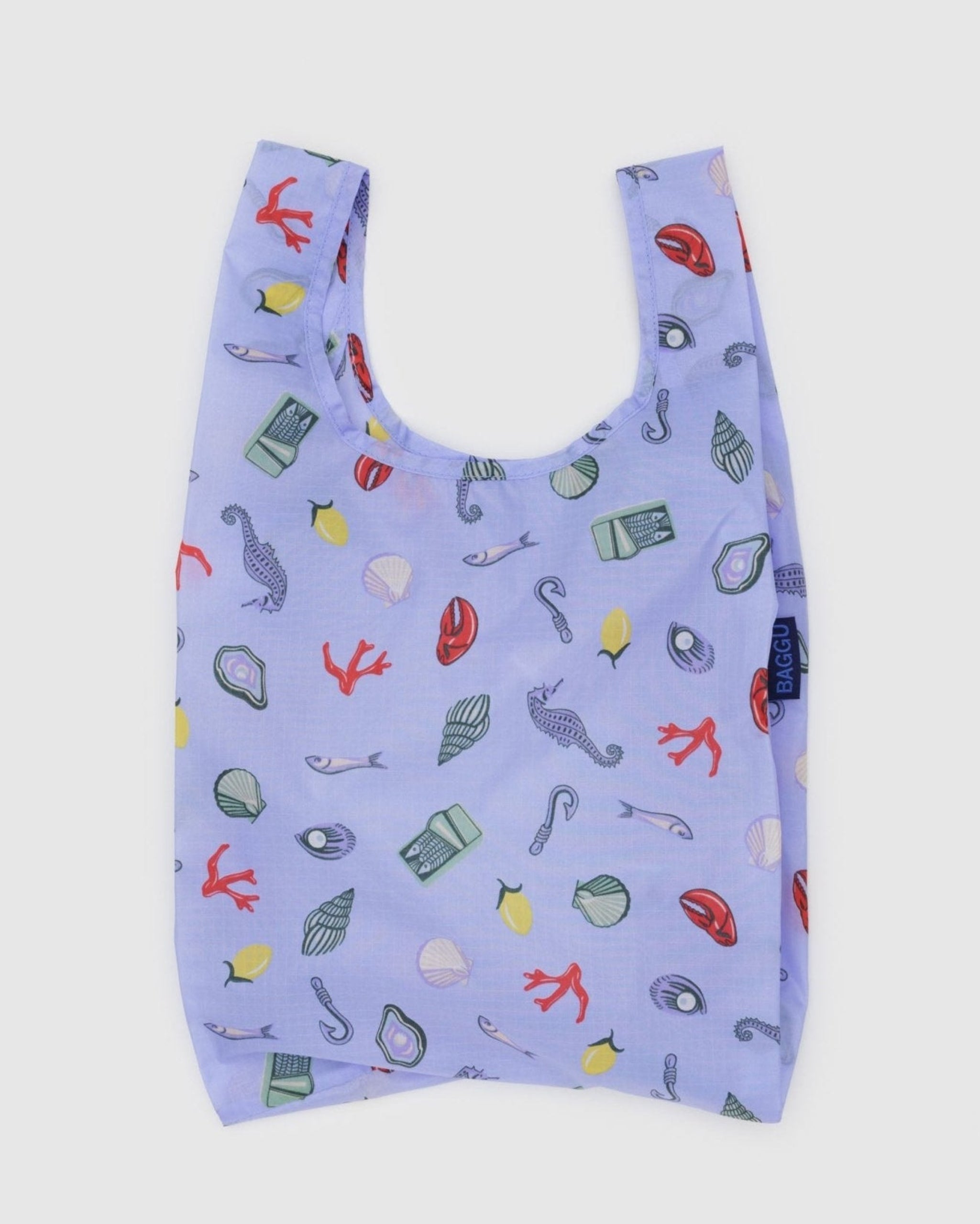 Blue with sea charm prints on a tote bag.
