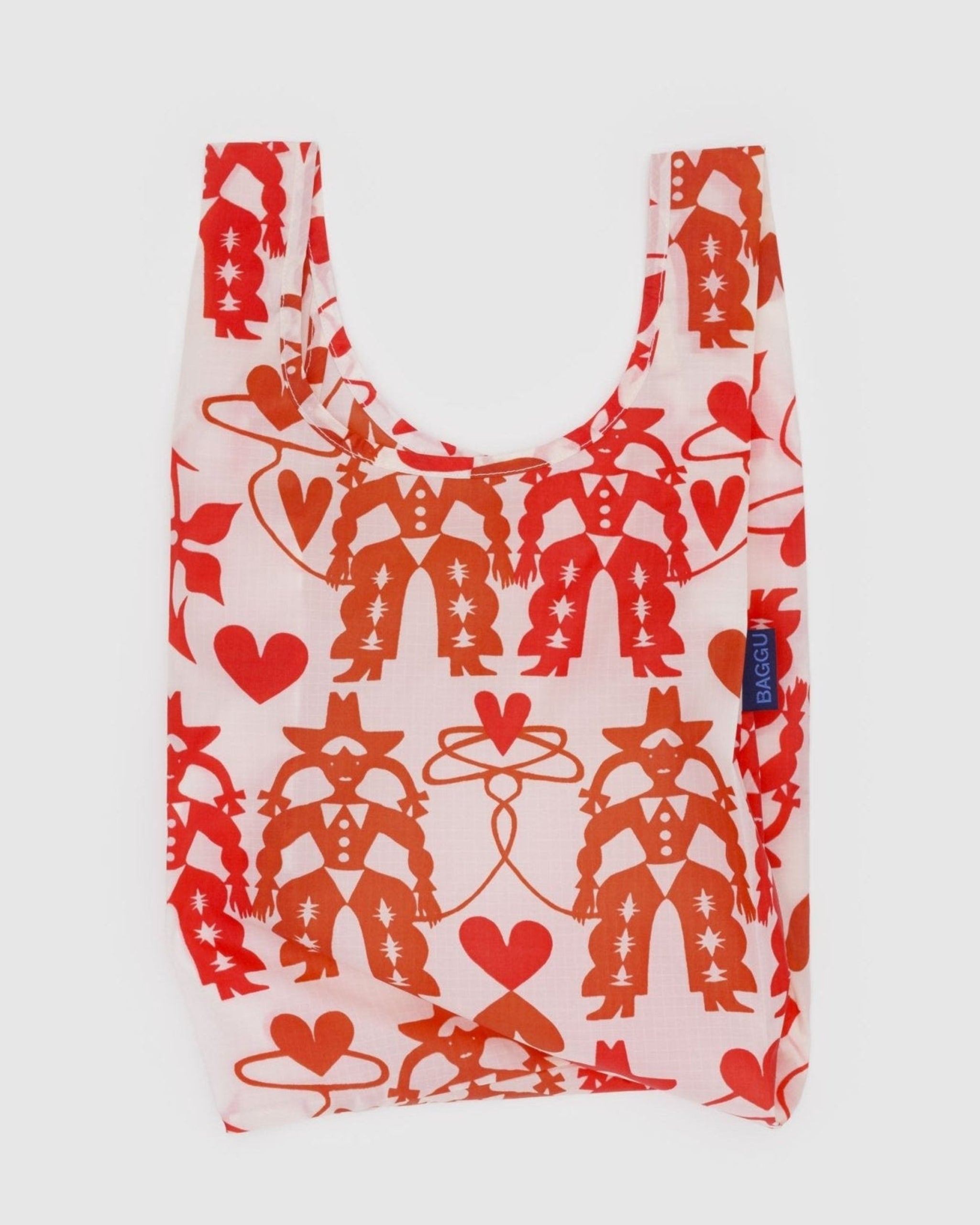 Baby size reusable shopping bag with red cowgirl and heart patterns and BAGGU tag on the side