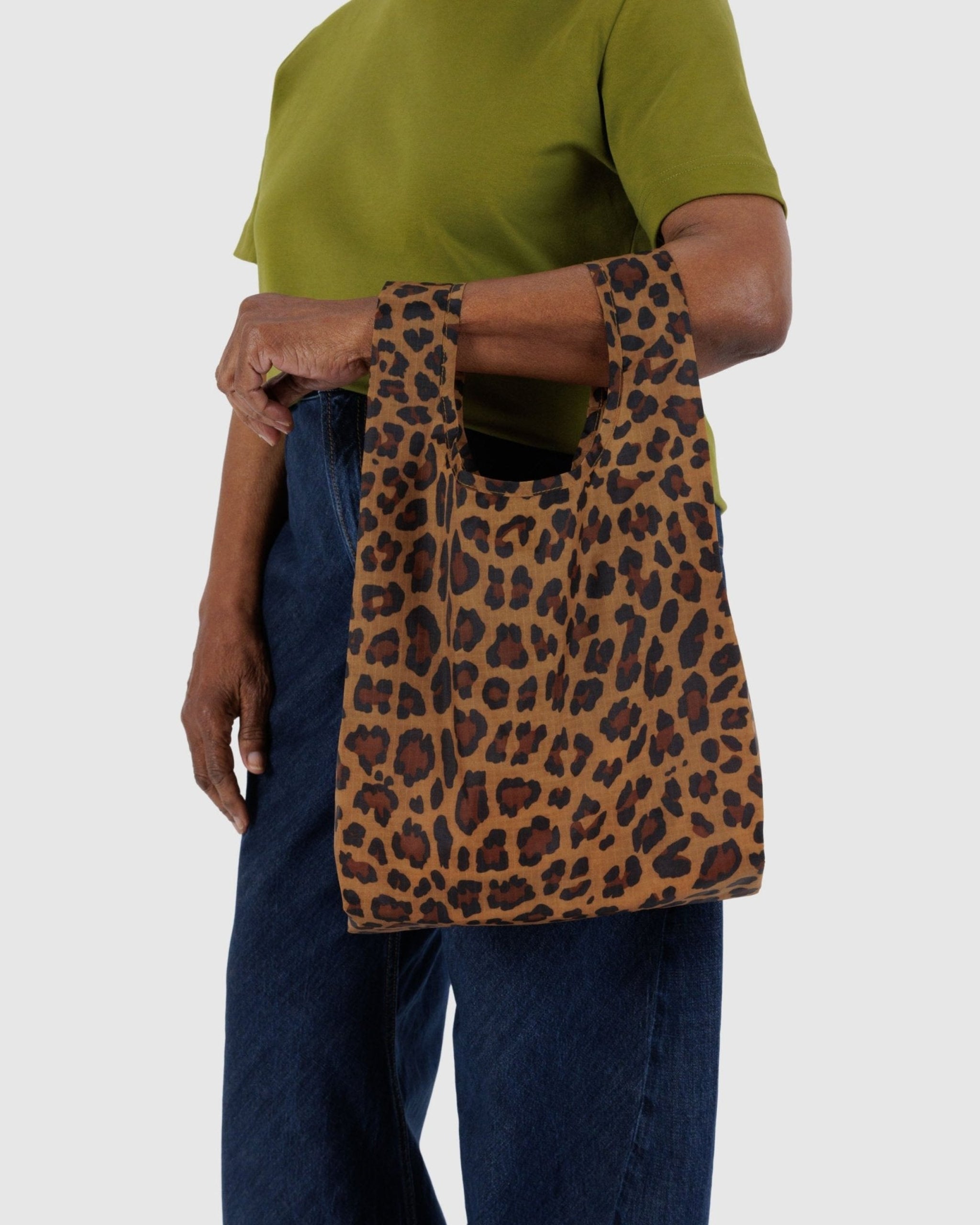 Person carrying a nylon tote on arm in leopard print - ANNIE.G