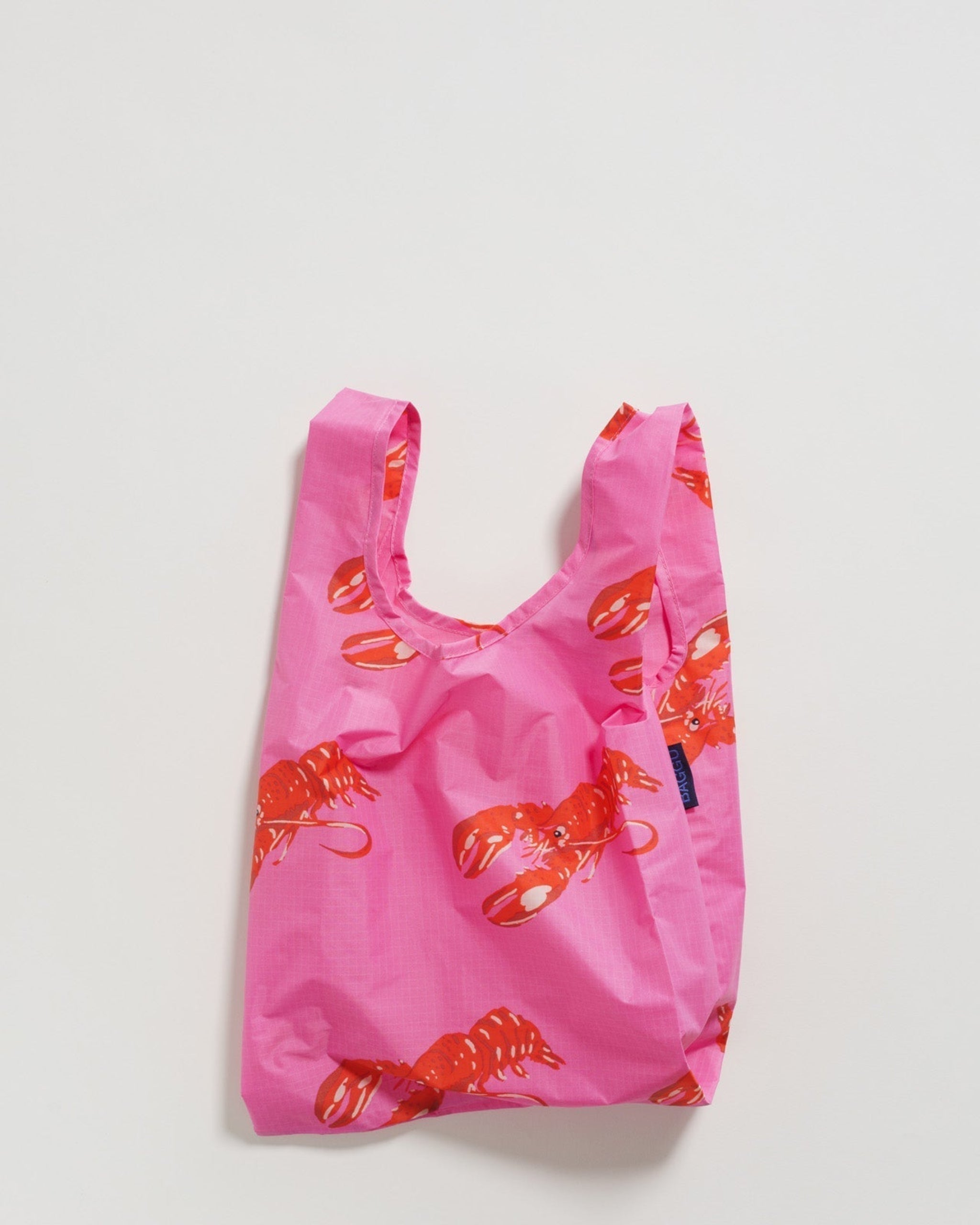 Pink with red lobster print reusable tote bag.
