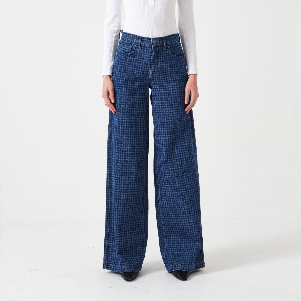 Person wearing blue houndstooth jeans