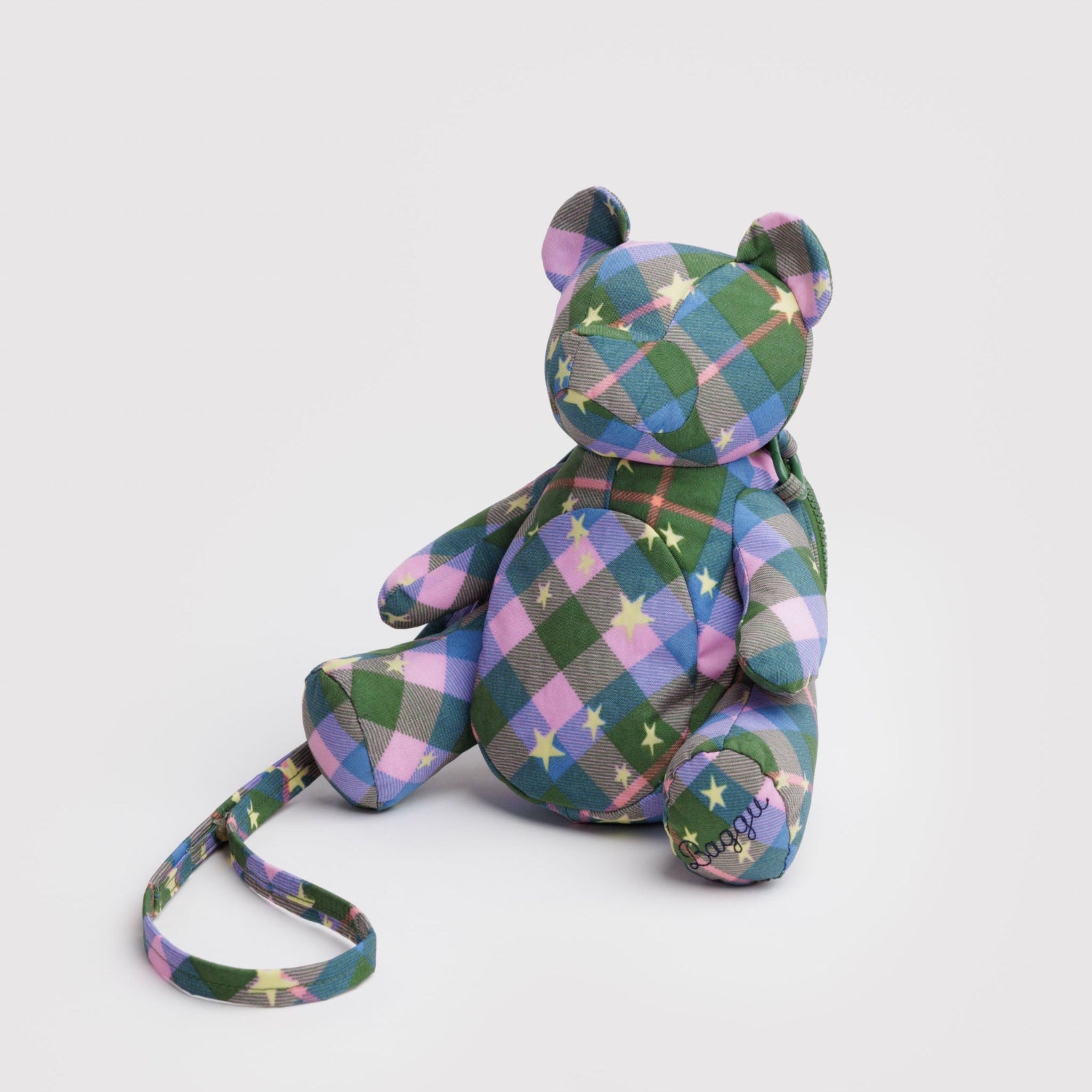 Green, blue and pink plaid patterned teddy bear bag with an adjustable crossbody strap.