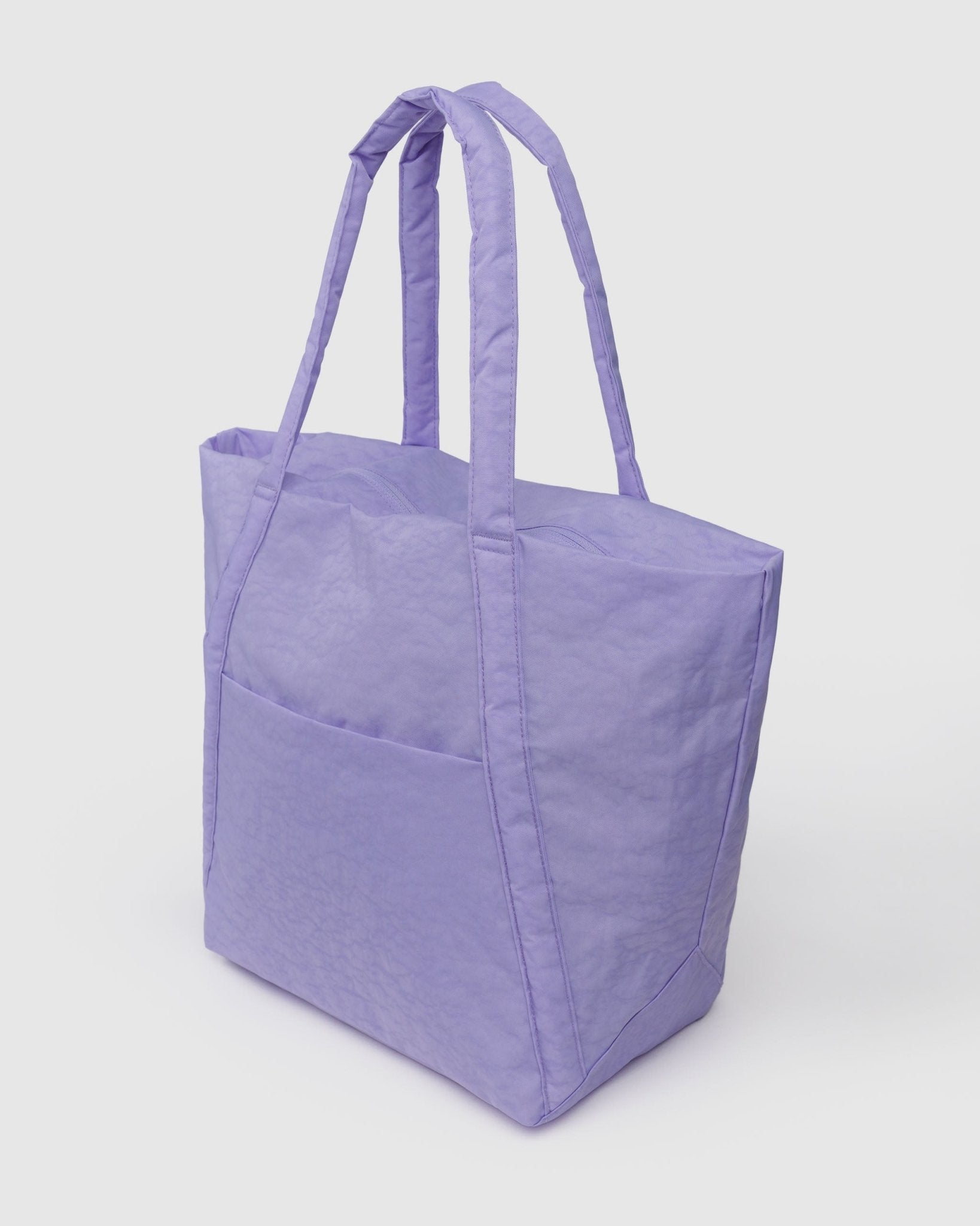 Side view of purple tote bag with carry handles