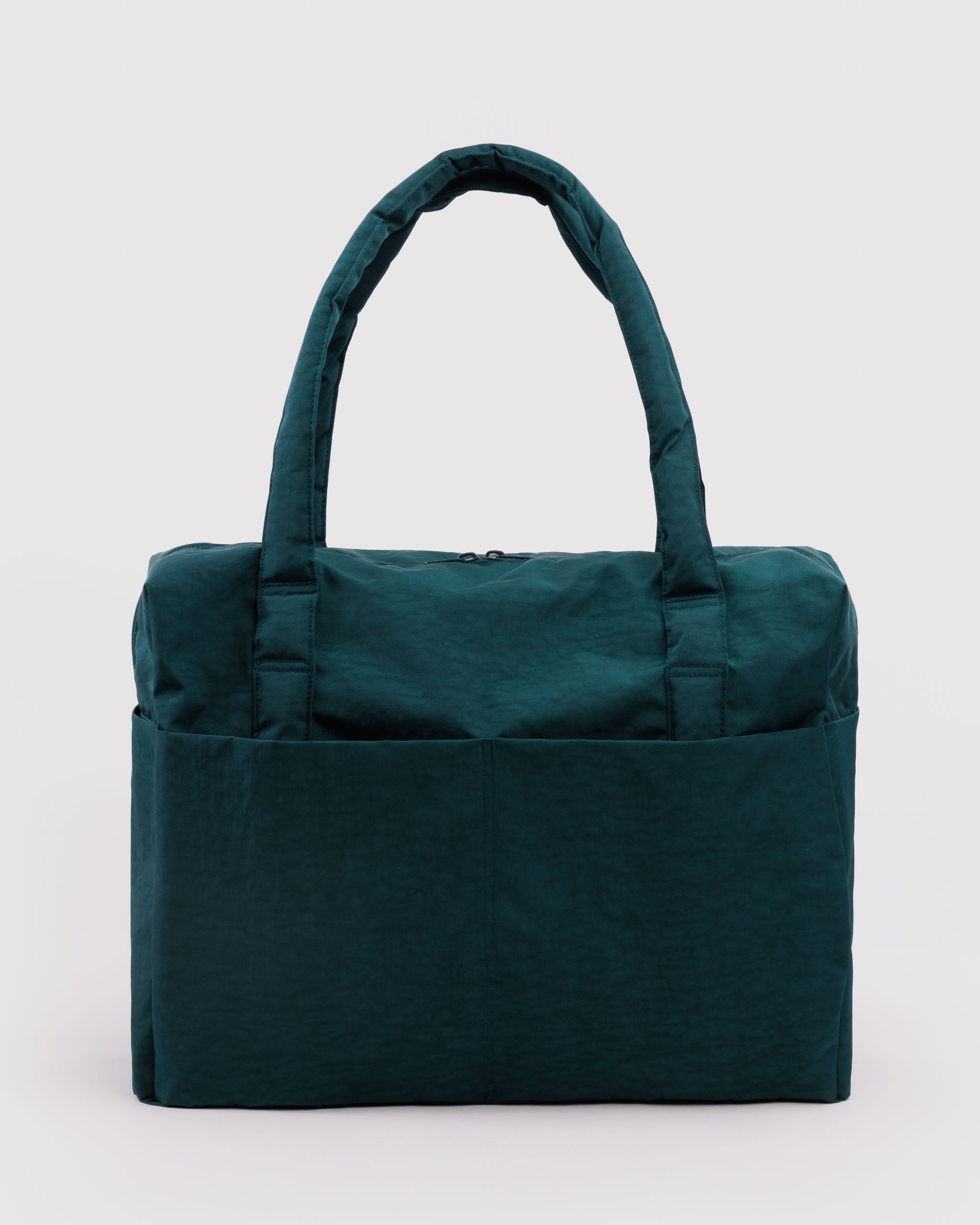 Green tote bag with carry handles and front pockets.