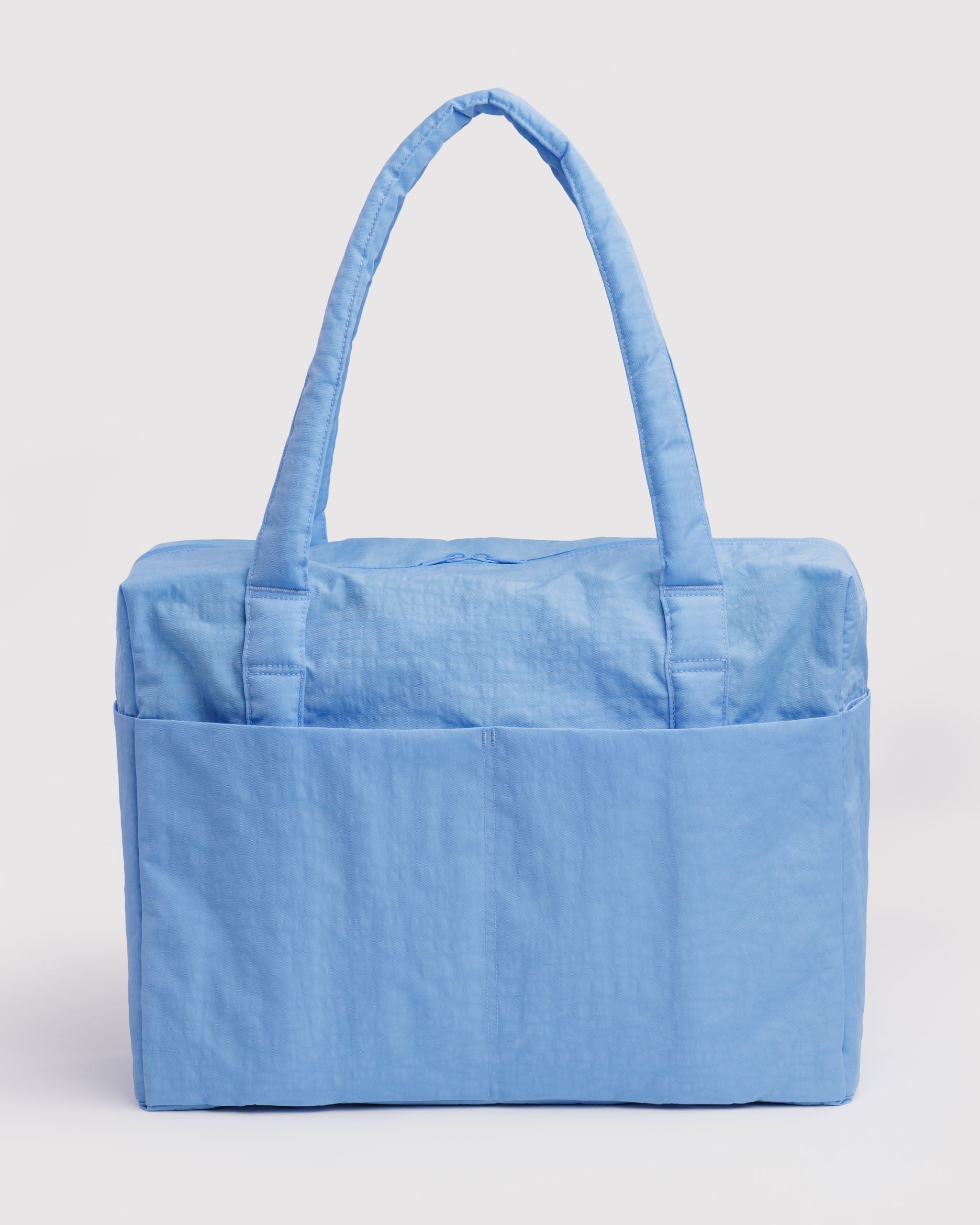 Light blue duffle bag with a handle and outside slip pockets