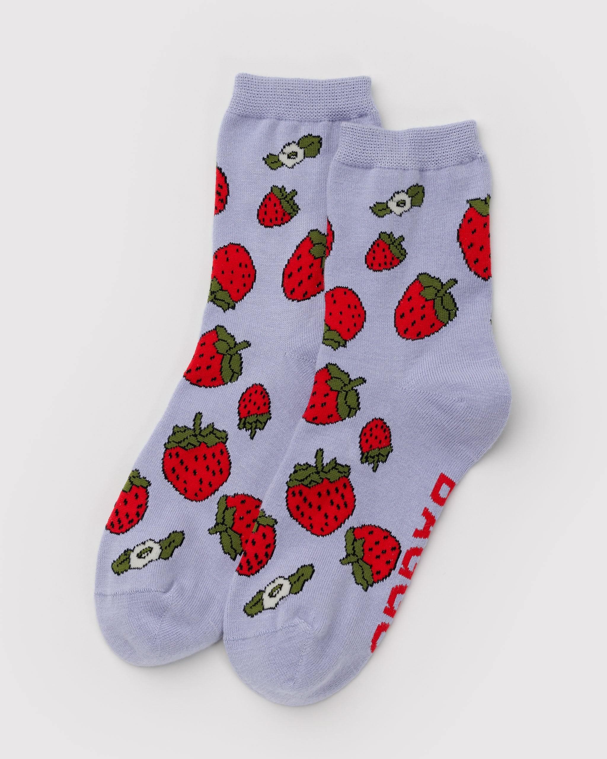 Pair of light blue socks with red strawberry pattern.