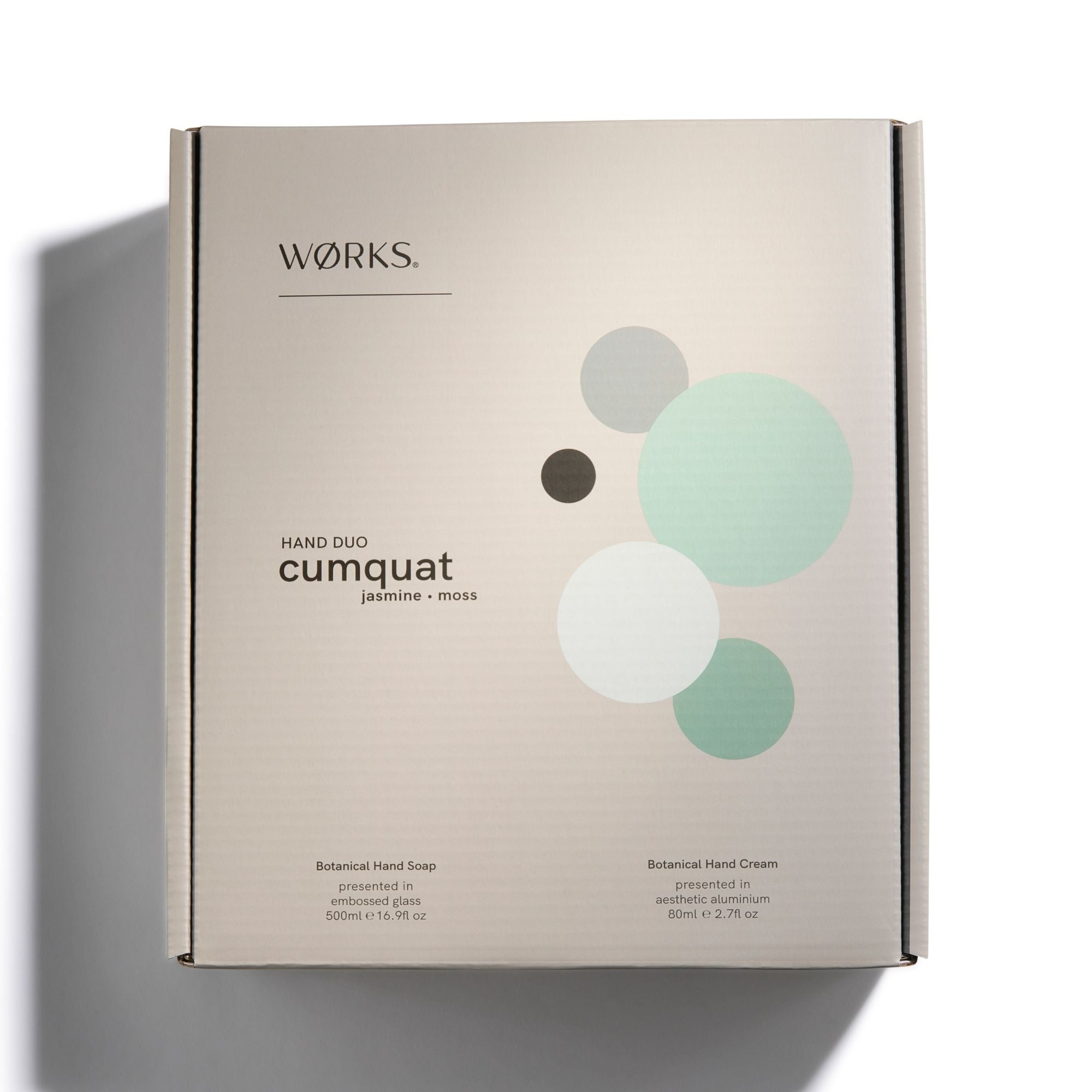 Works hand care product packaging with 'cumquat' and 'jasmine + moss' text and circle design.