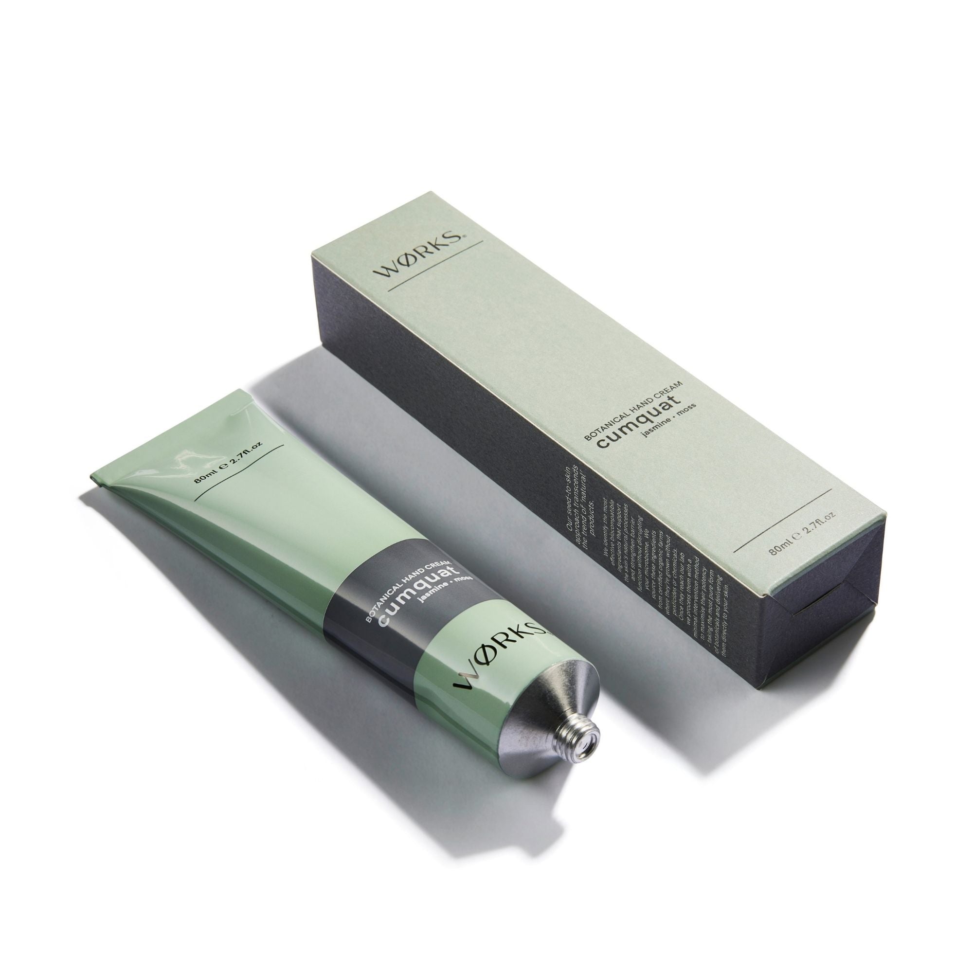 Green skincare product tube and matching box packaging.