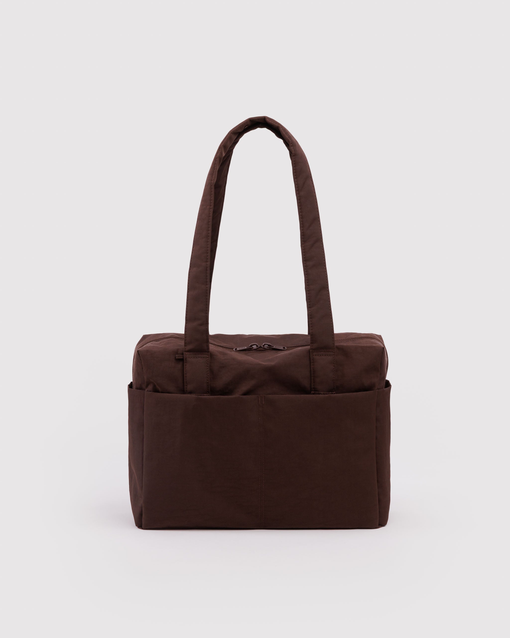 Brown duffle bag with outside pockets and carry handles.