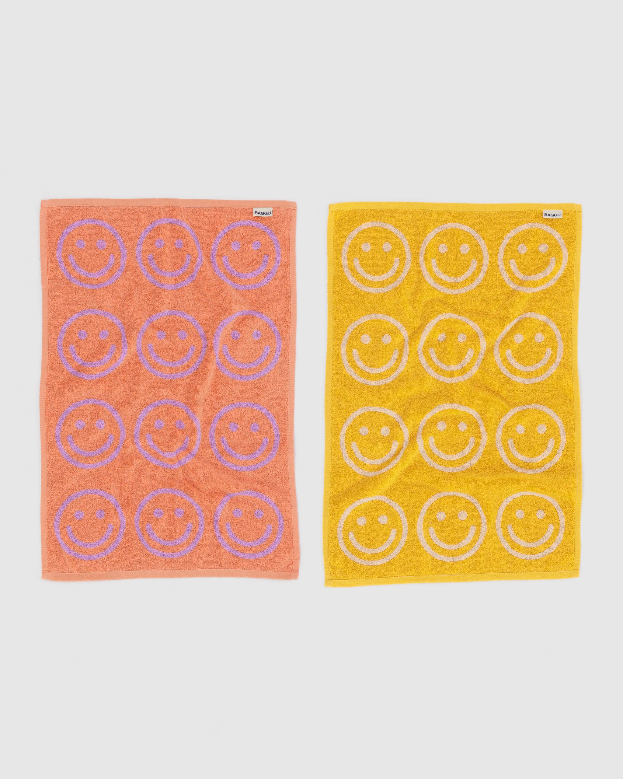 back-reverse-side-of-lilac-and-marigold-hand-towels-reversible-pattern-of-smiley-face-with-brand-label