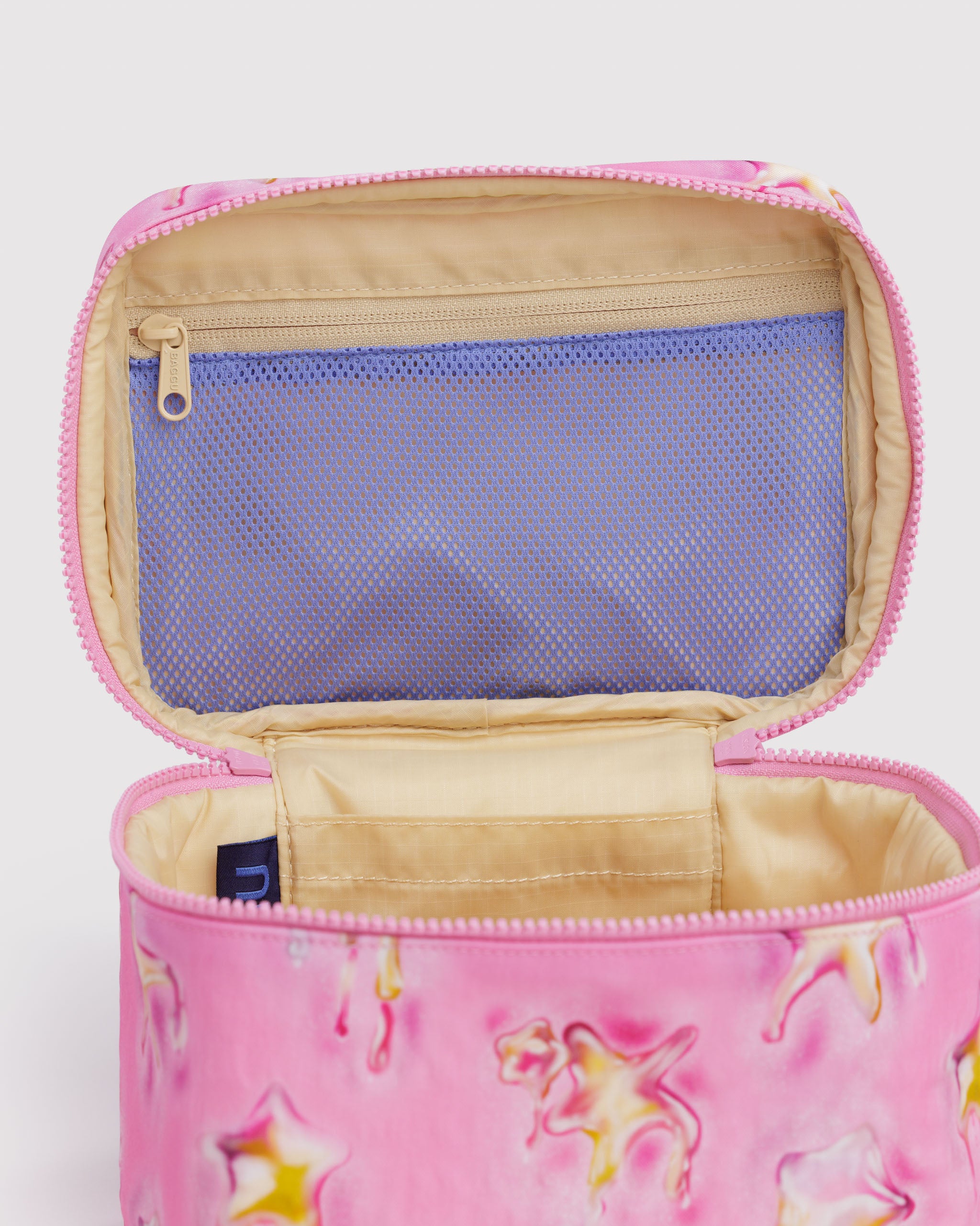 Pink and yellow star patterned pouch with a purple mesh zip pocket on lid