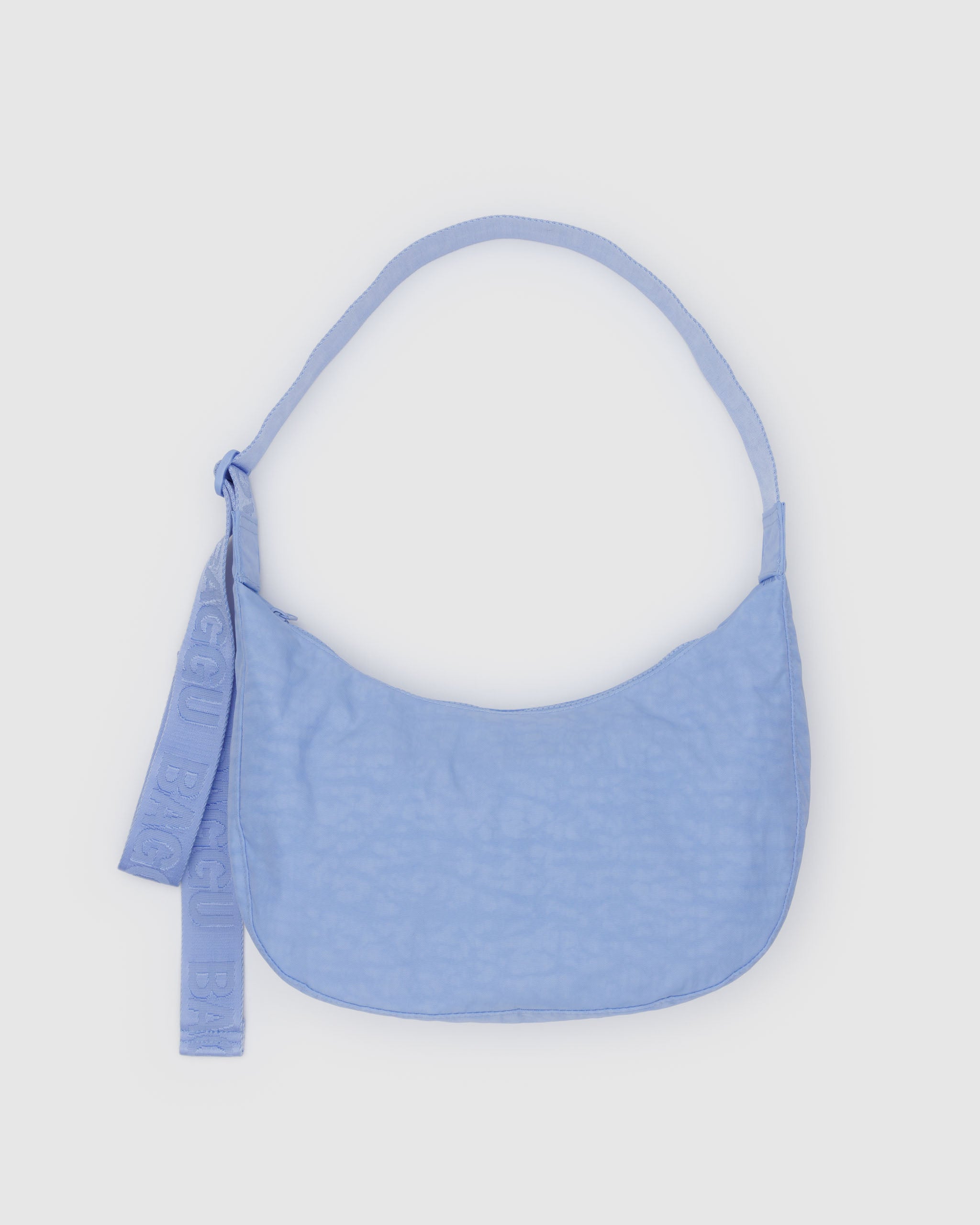 french-blue-coloured-medium-nylon-crescent-bag-adjustable-shoulder-strap-flatlay