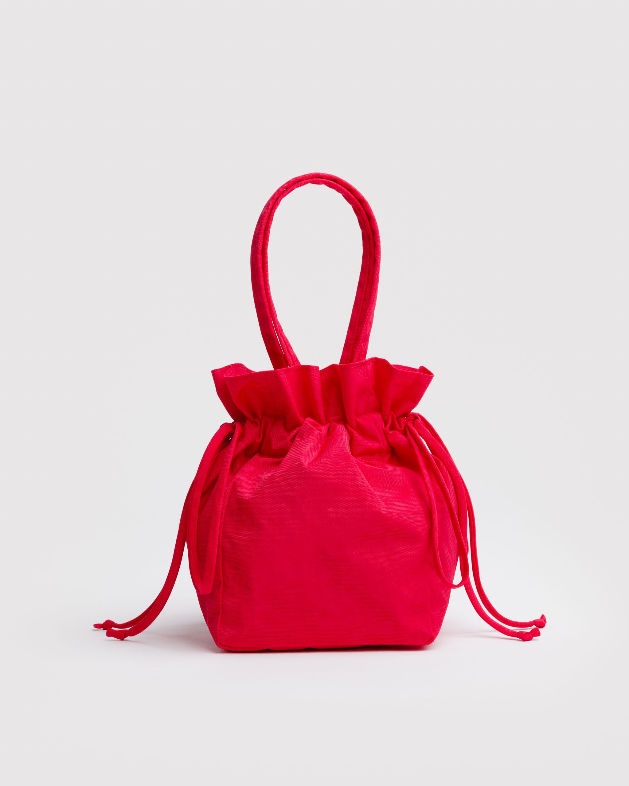 Red drawstring handbag with handles.