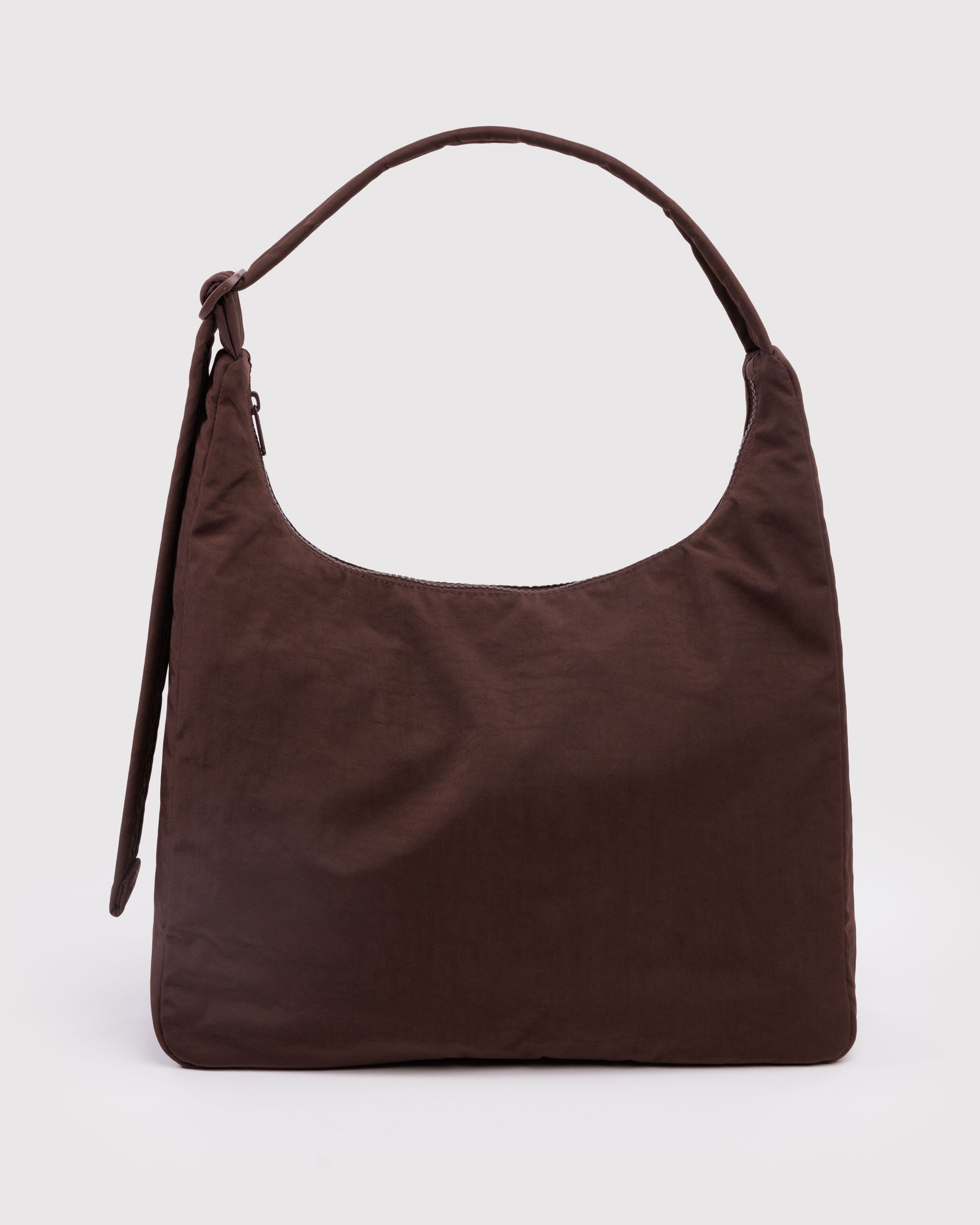 Brown shoulder bag with adjustable shoulder strap and top zip closure.
