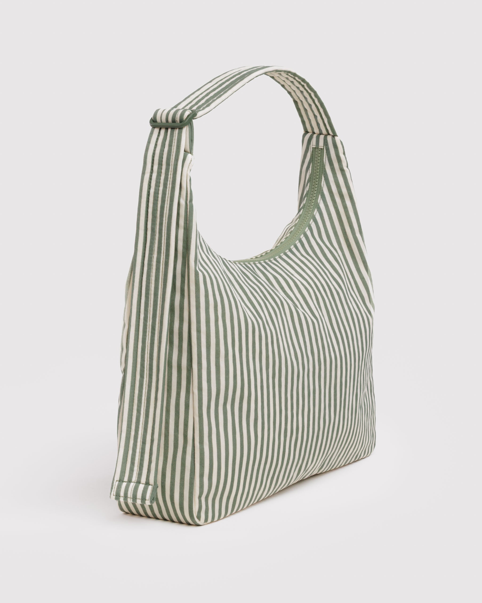 Green and white striped shoulder bag with adjustable strap and top zip closure.