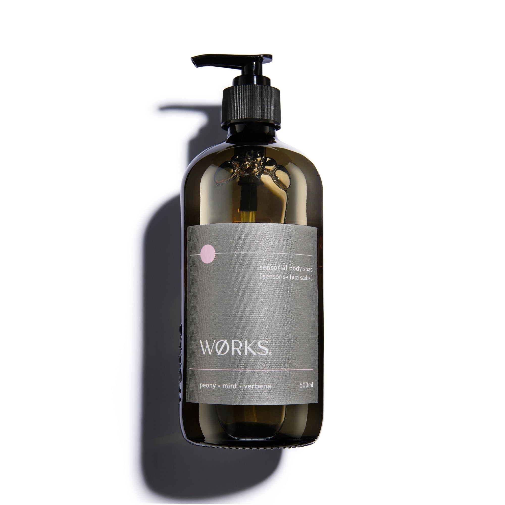 Brown bottle with pump and grey label.