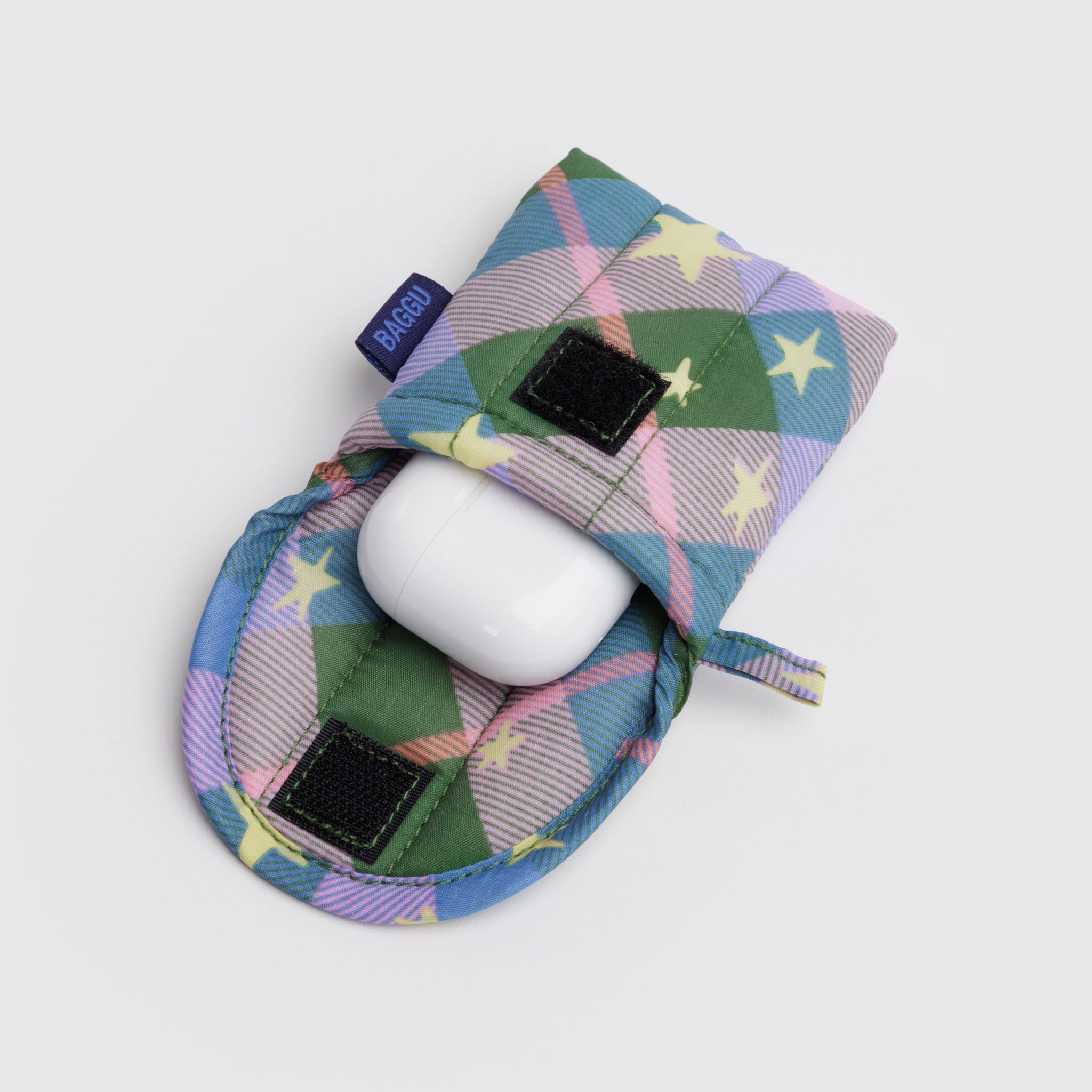 Green plaid with stars quilted earbuds pouch with earbuds case inside, velcro flap open and BAGGU label and hanging loop on the side.