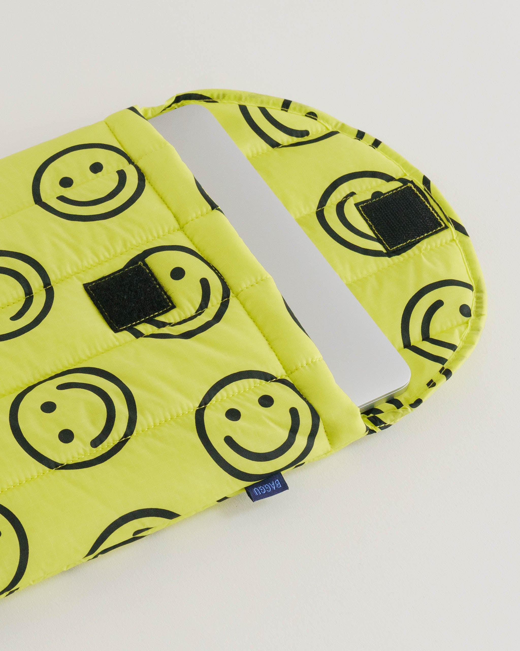 yellow-with-black-happy-face-print-laptop-sleeve-open-with-laptop